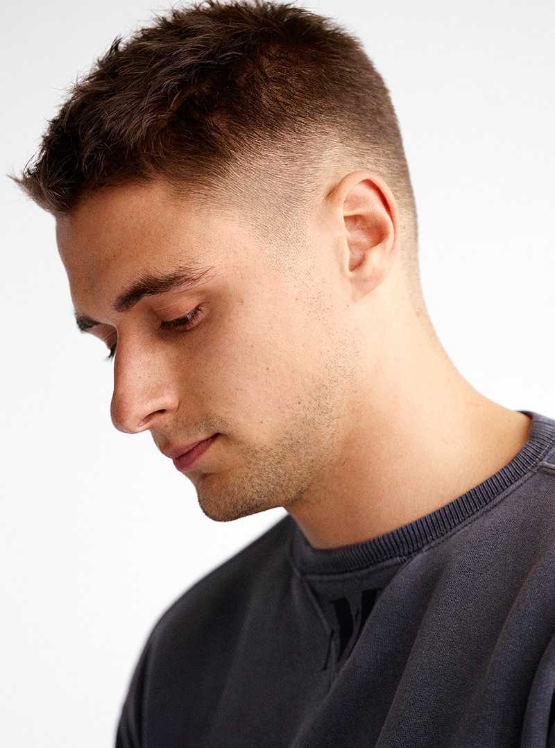 Cute kid boy have hair cut, professional barber doing haircut. Hairdress for  children. Kid side view portraits in the barbershop Stock Photo - Alamy