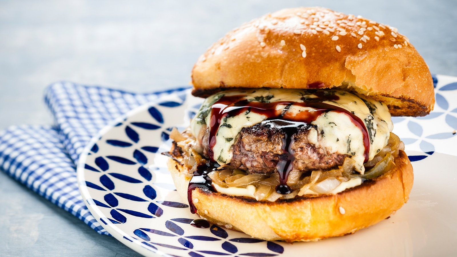 Peaky Blinders Manchester - Peaky Signature Burger ⁠ Ground brisket &  chunk steak patty, golden caramelised onions, black wax cheddar, shredded  lettuce and Peaky burger sauce. Perfectly paired with a cold pint