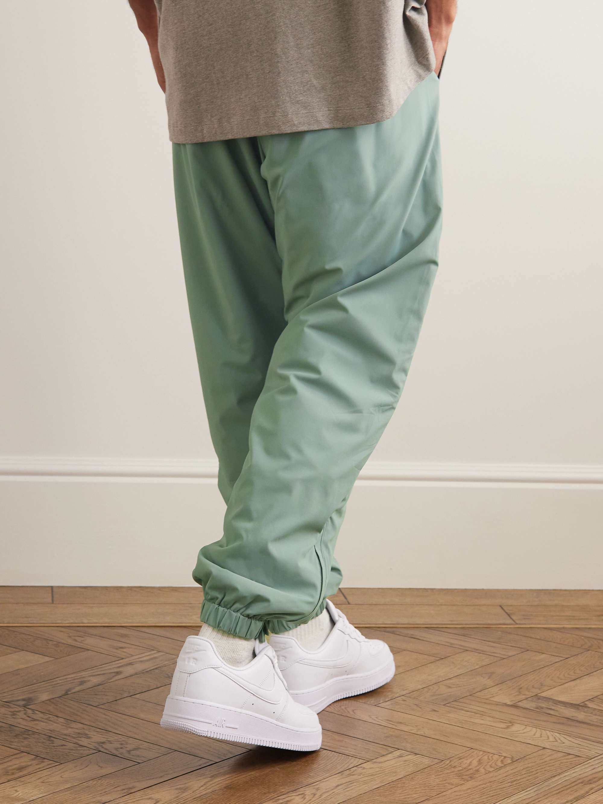 FEAR OF GOD ESSENTIALS Tapered Logo-Appliquéd Padded Stretch-Shell Drawstring Trousers
