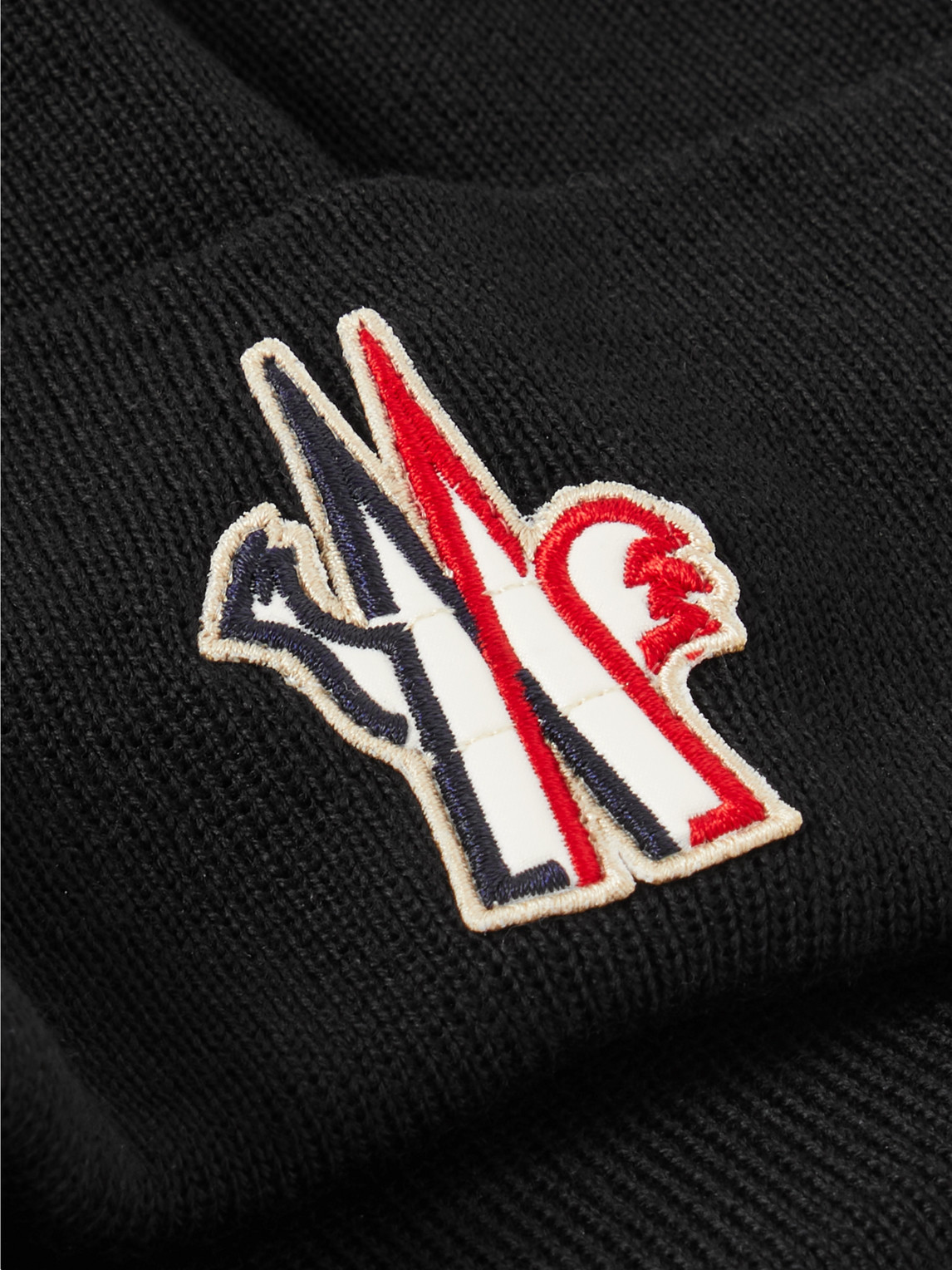 Shop Moncler Logo-appliquéd Ribbed Wool Beanie In Black