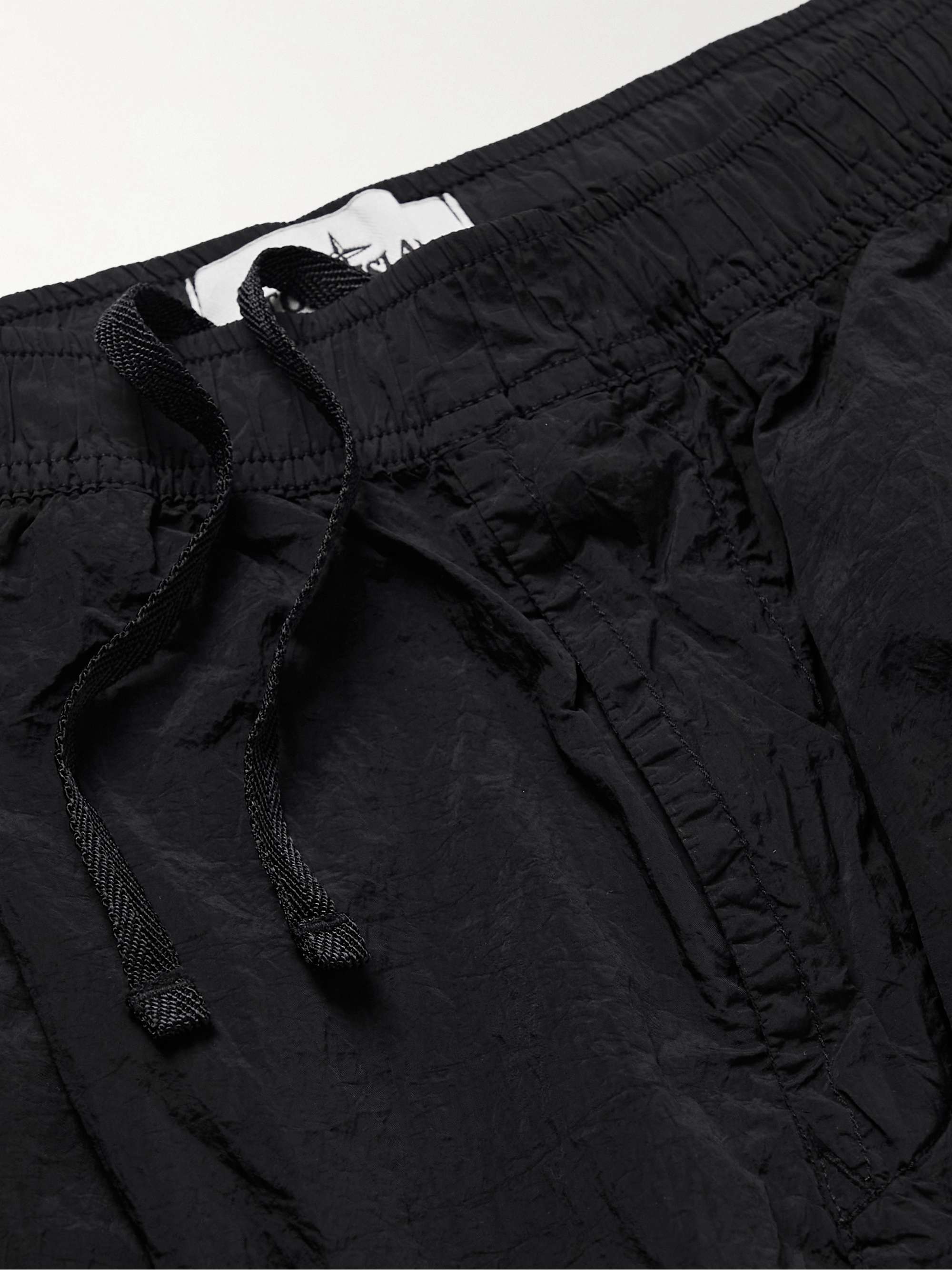 STONE ISLAND Slim-Fit Tapered Logo-Appliquéd Metallic Shell Trousers