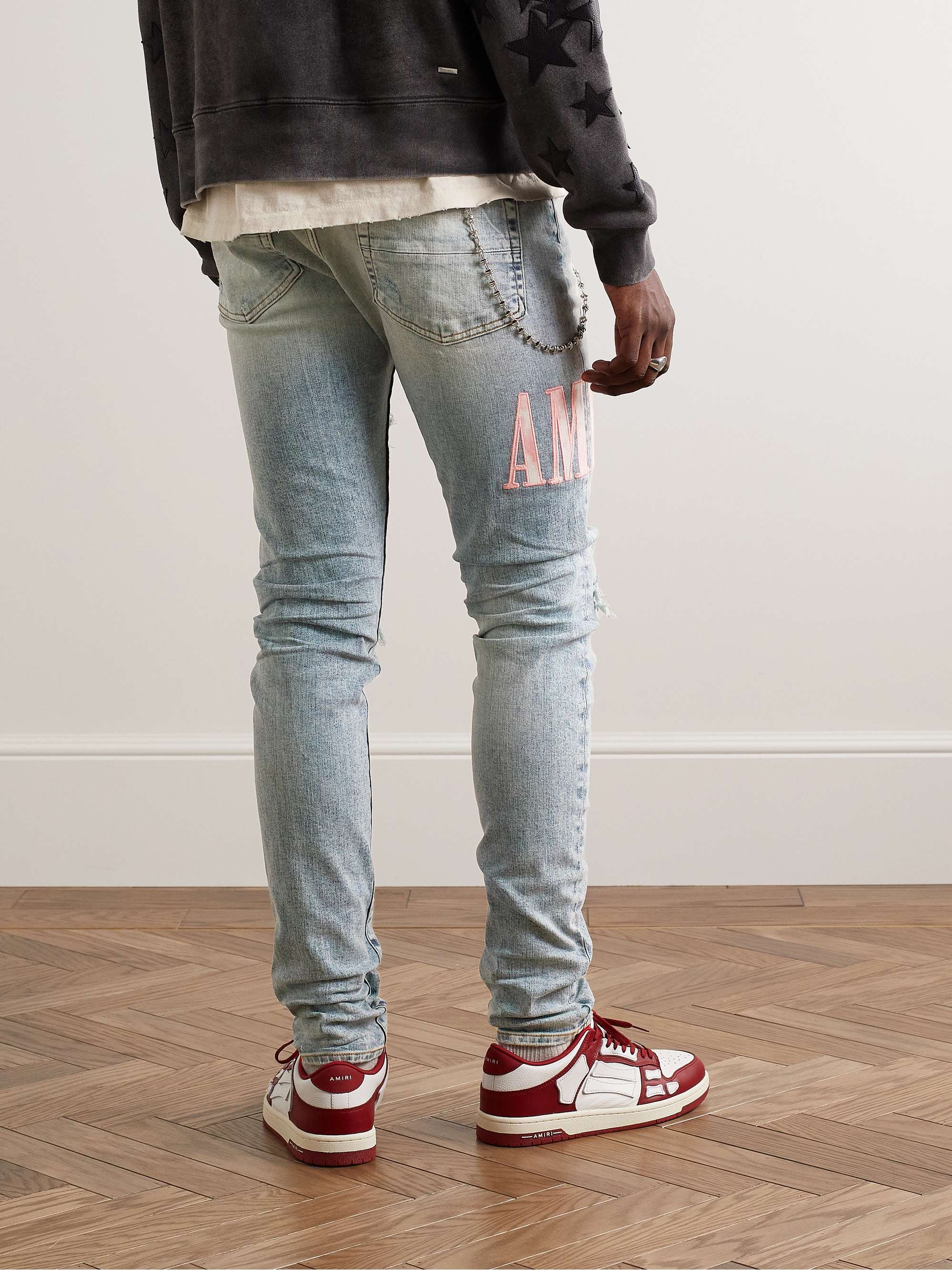 AMIRI Skinny-Fit Logo-Appliquéd Distressed Jeans