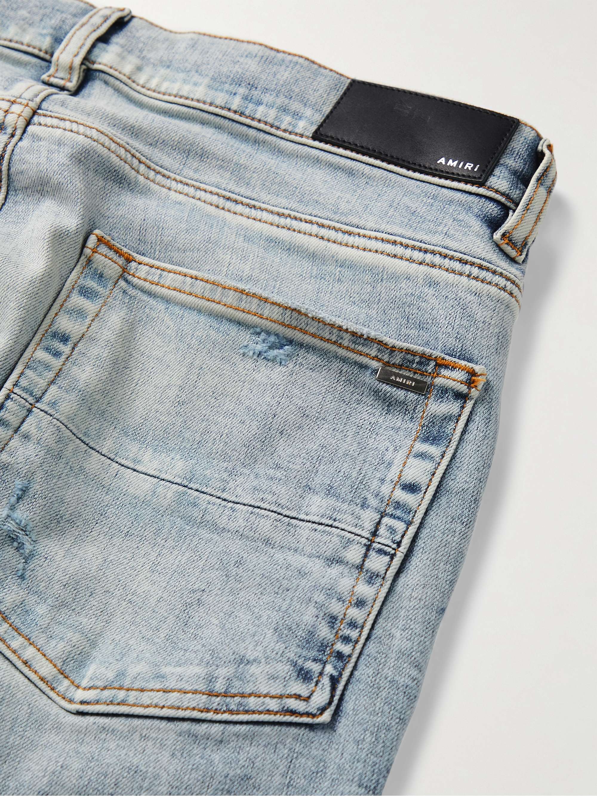 AMIRI Skinny-Fit Logo-Appliquéd Distressed Jeans