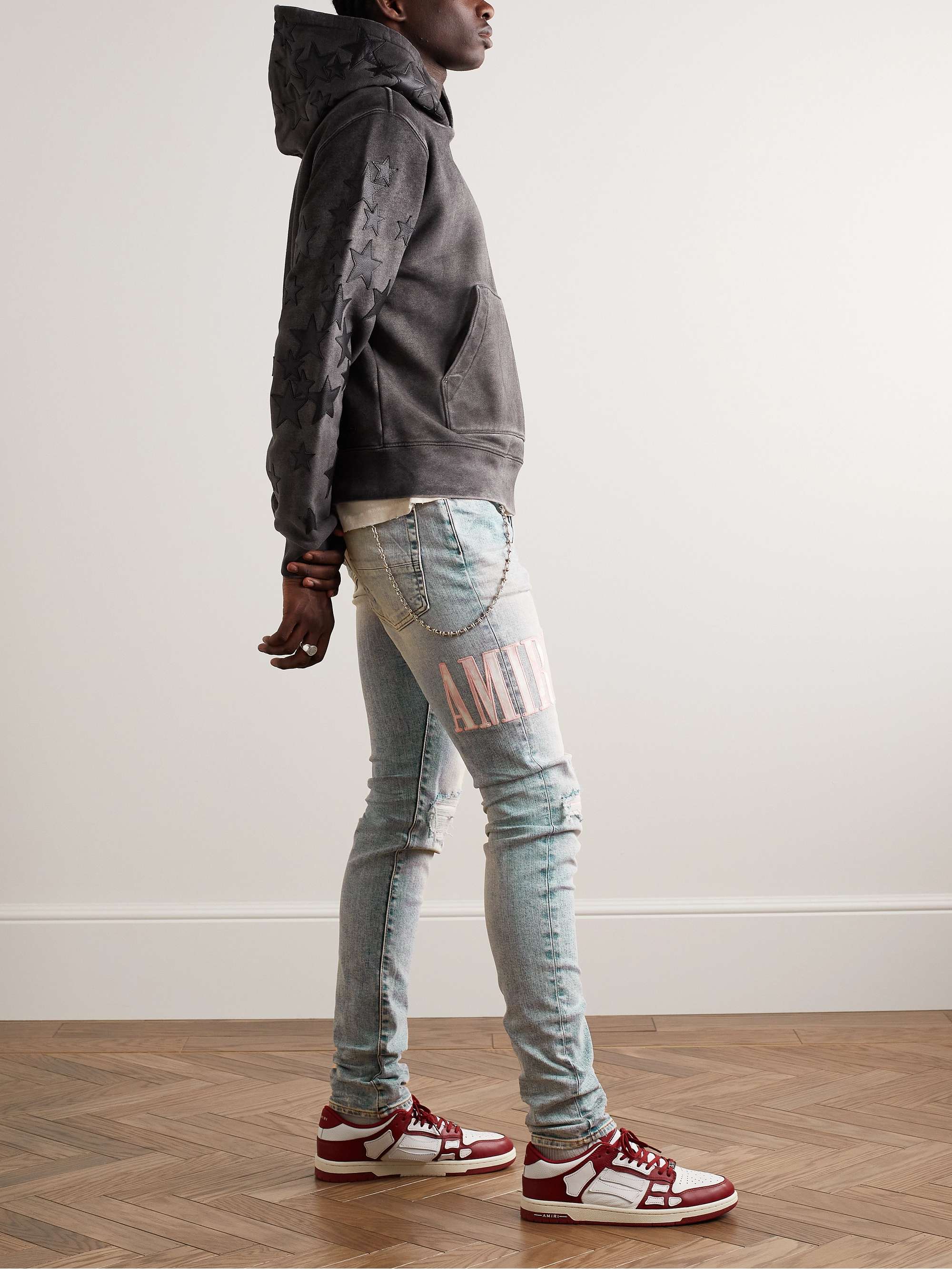 AMIRI Skinny-Fit Logo-Appliquéd Distressed Jeans