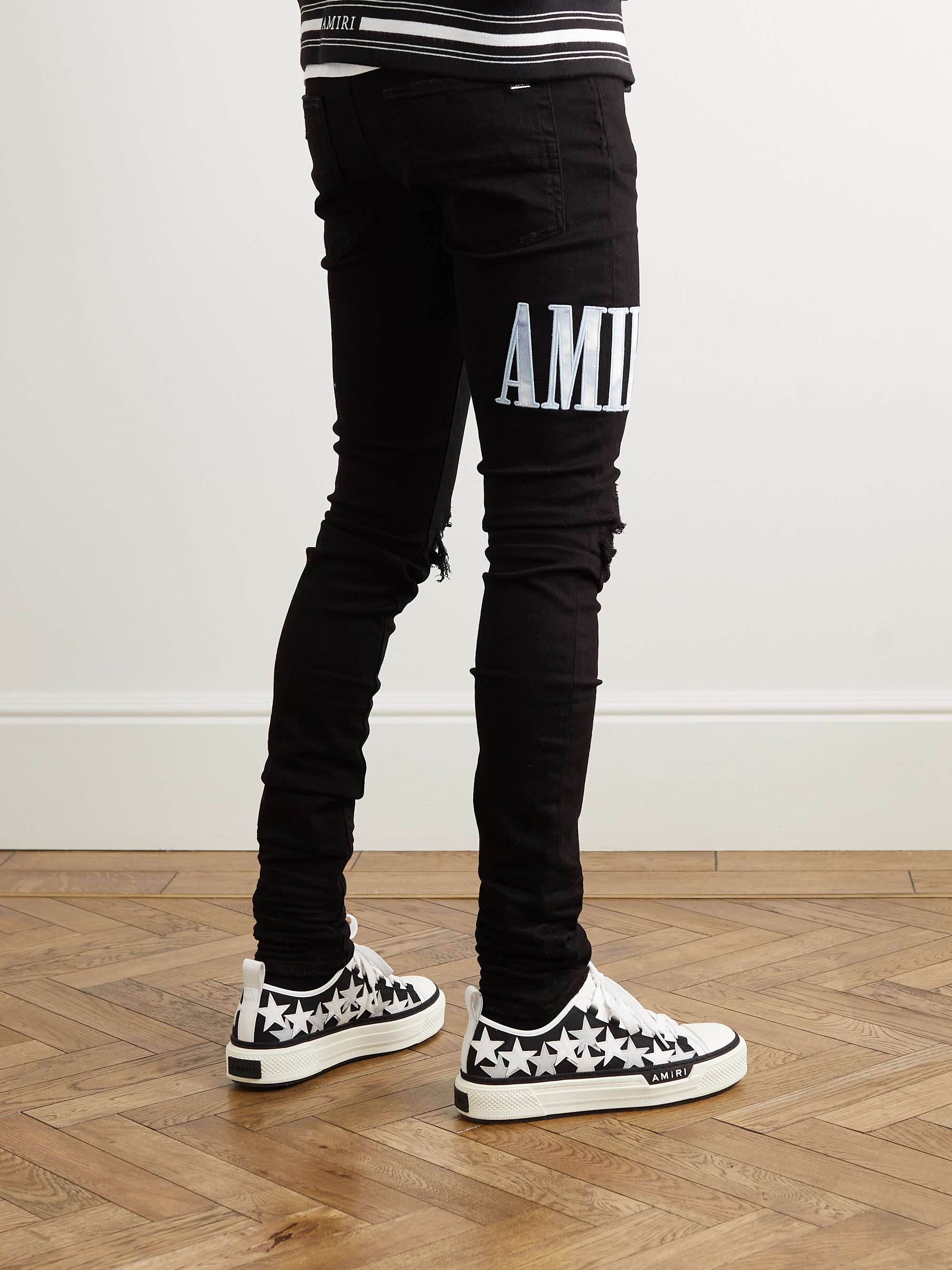 AMIRI Skinny-Fit Logo-Appliquéd Distressed Jeans