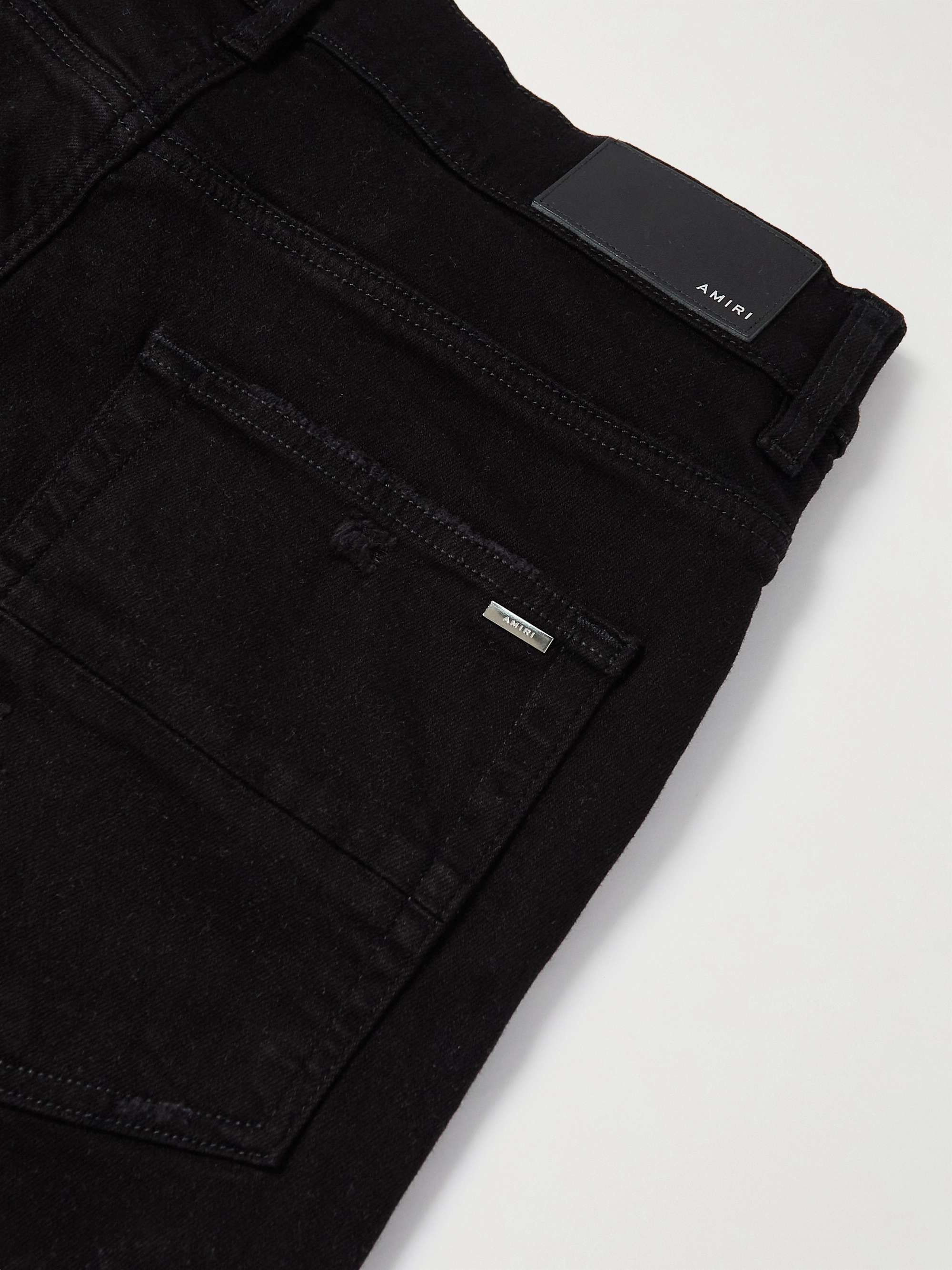 AMIRI Skinny-Fit Logo-Appliquéd Distressed Jeans
