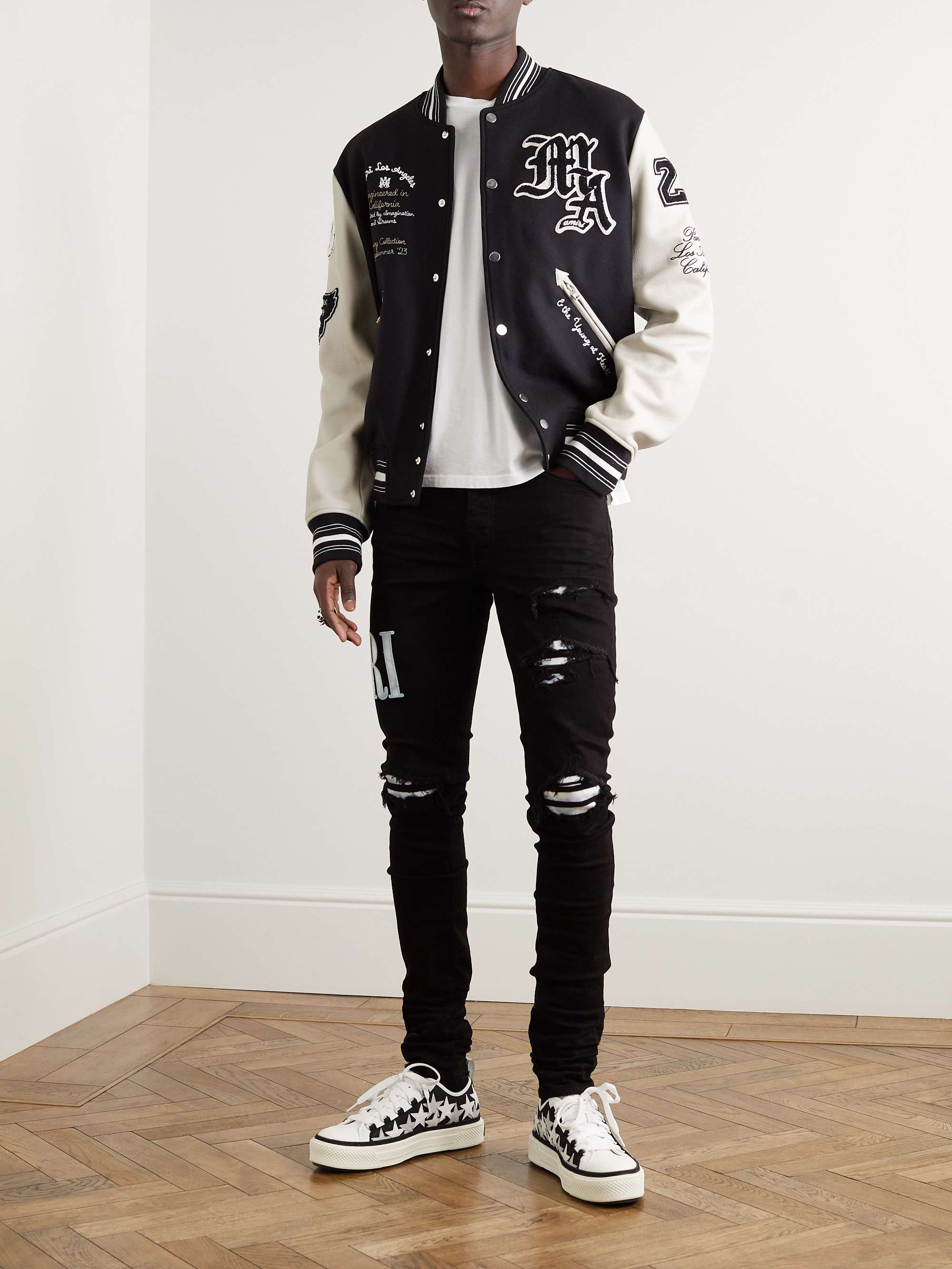 AMIRI Skinny-Fit Logo-Appliquéd Distressed Jeans