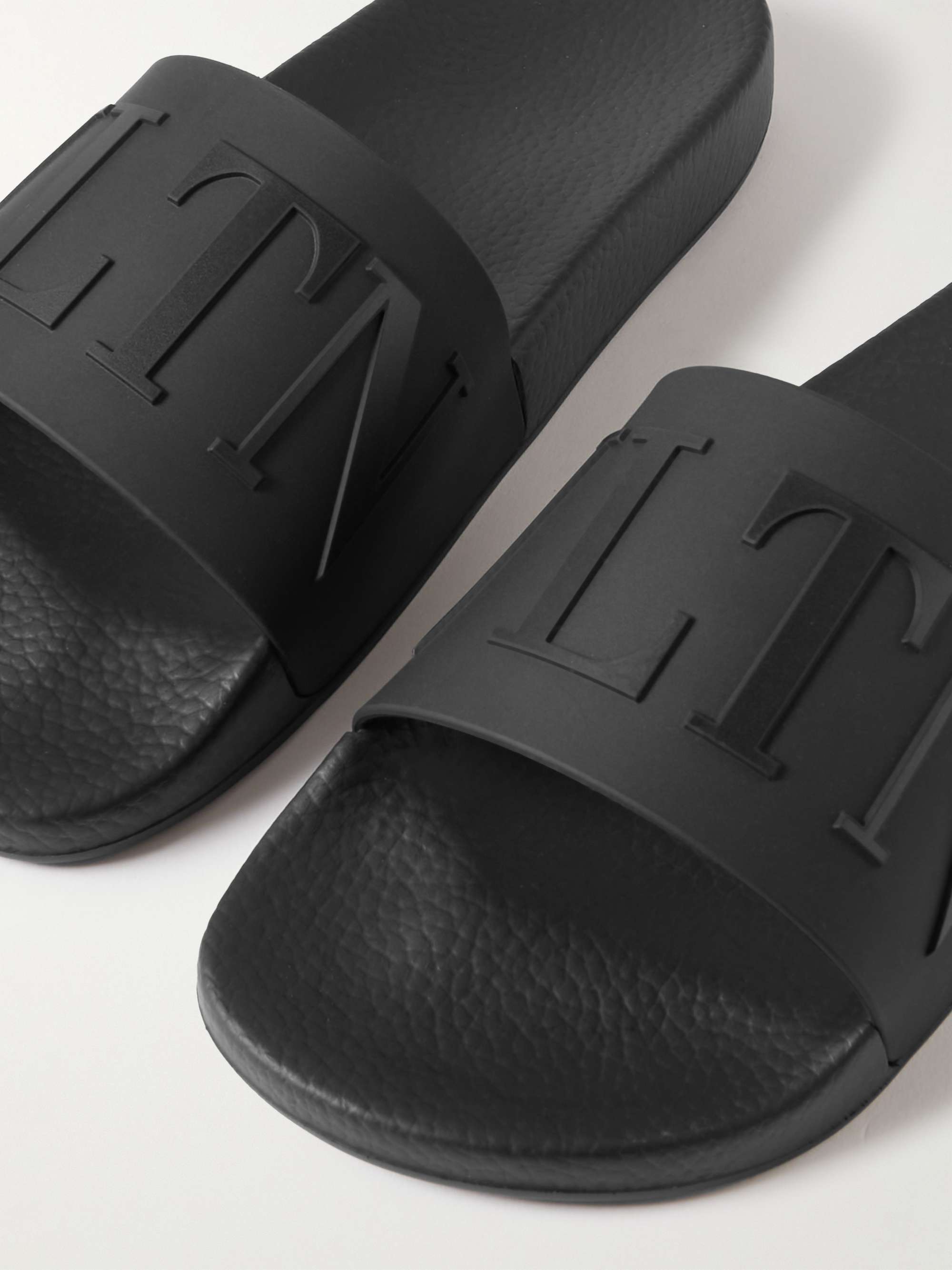 VALENTINO GARAVANI Valentino Garavani Logo-Embossed Rubber Slides