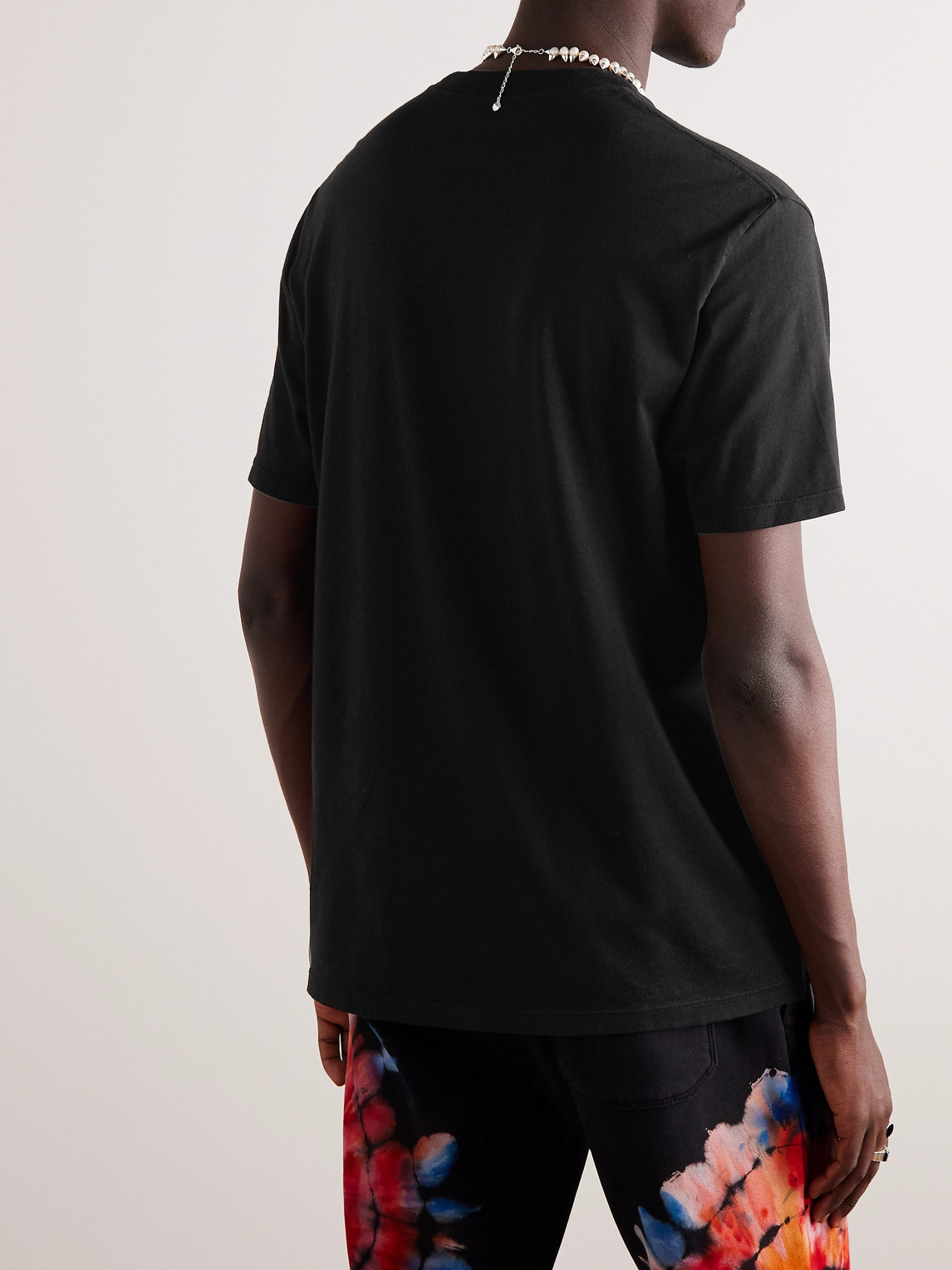 Shop Amiri Logo-appliquéd Cotton-jersey T-shirt In Black