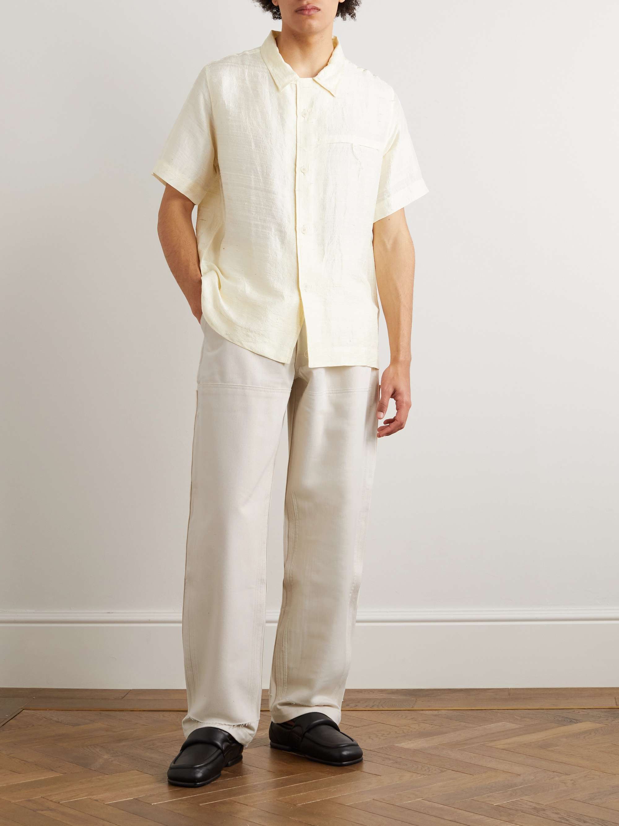 AIREI Straight-Leg Distressed Panelled Cotton-Twill Trousers