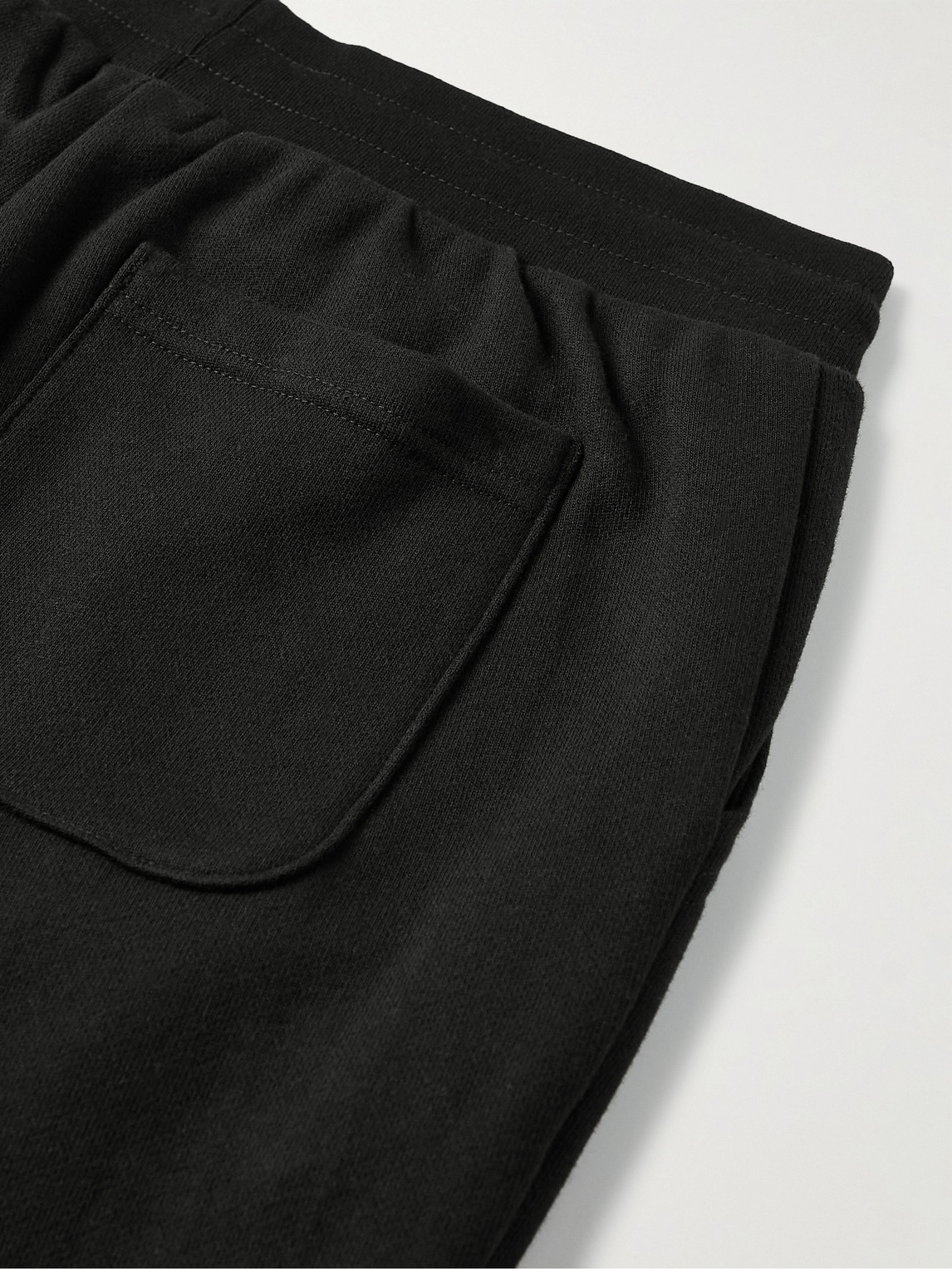 Shop John Elliott La Tapered Cotton-jersey Sweatpants In Black
