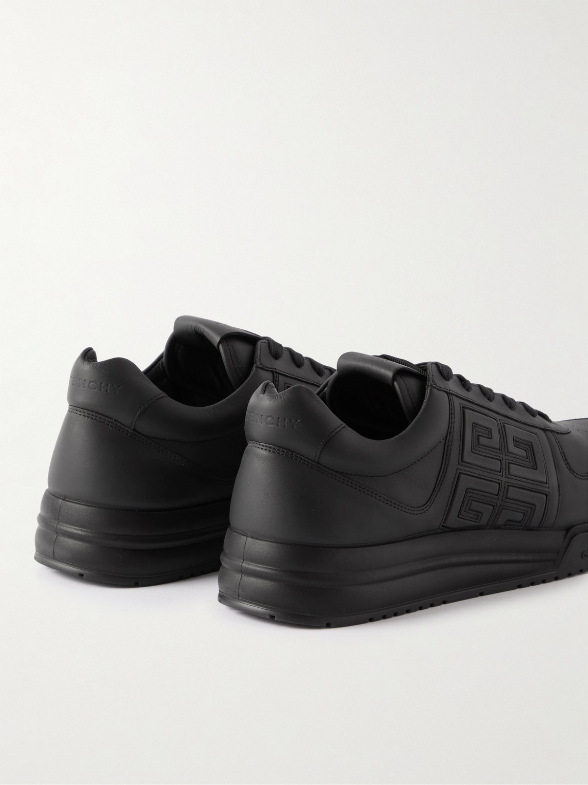 Shop Givenchy G4 Logo-embossed Leather Sneakers In Black