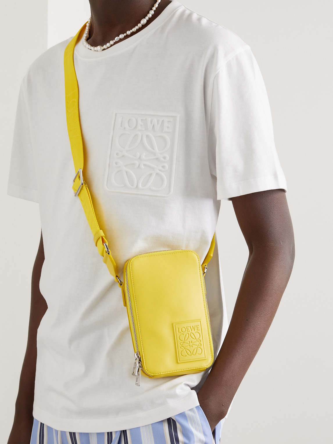 Shop Loewe Logo-debossed Leather Messenger Bag In Yellow