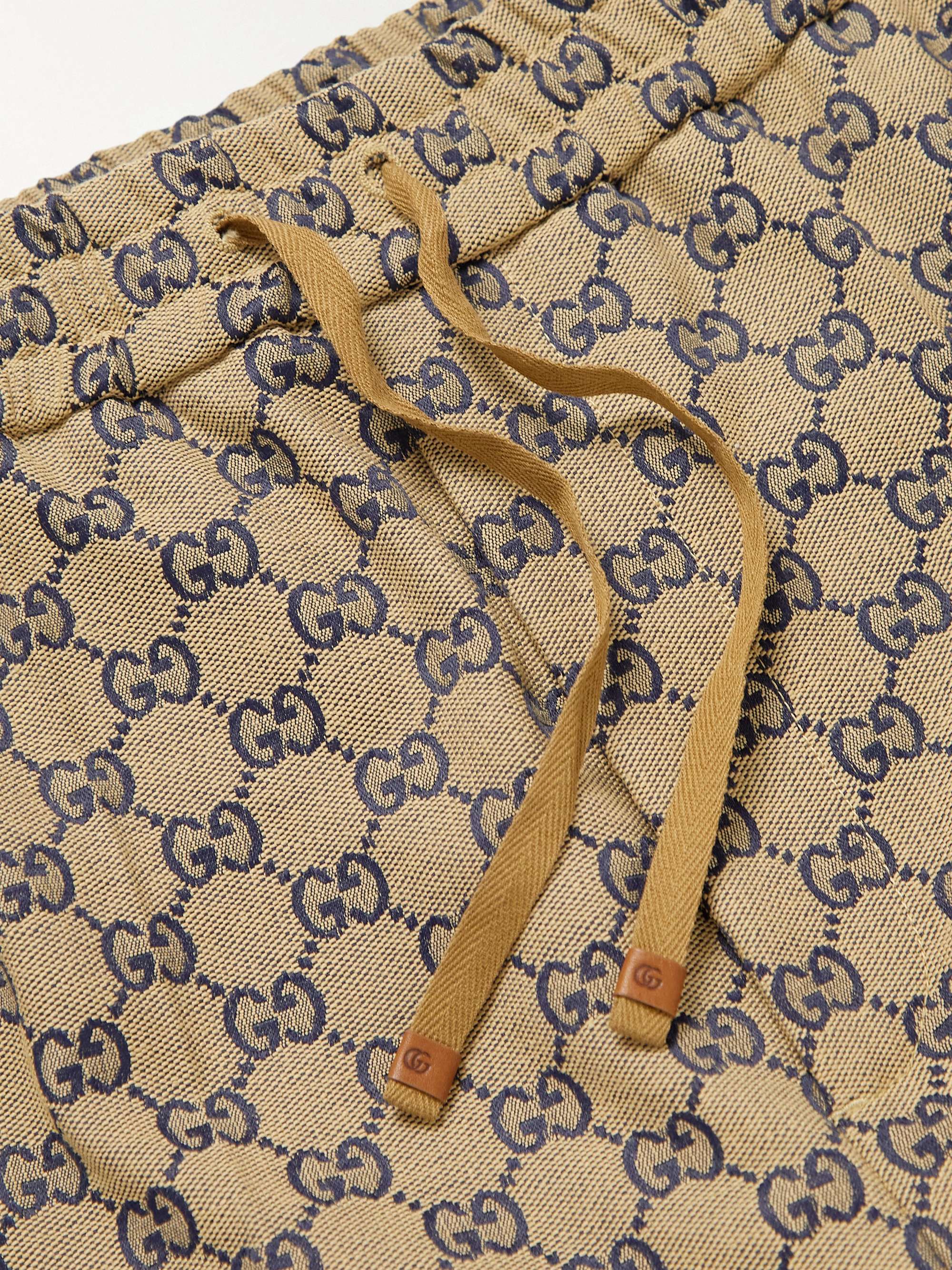 GUCCI Tapered Webbing-Trimmed Monogrammed Cotton-Blend Jacquard Drawstring Trousers