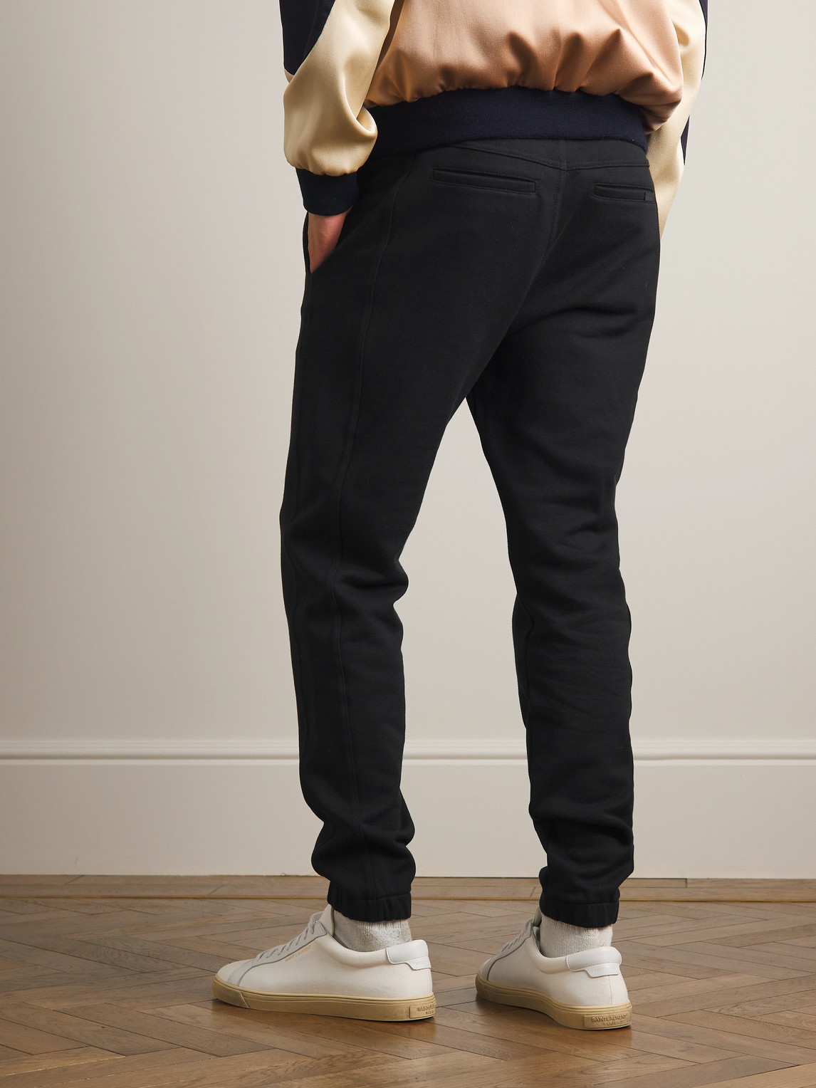 Shop Saint Laurent Tapered Logo-embroidered Cotton-jersey Sweatpants In Black