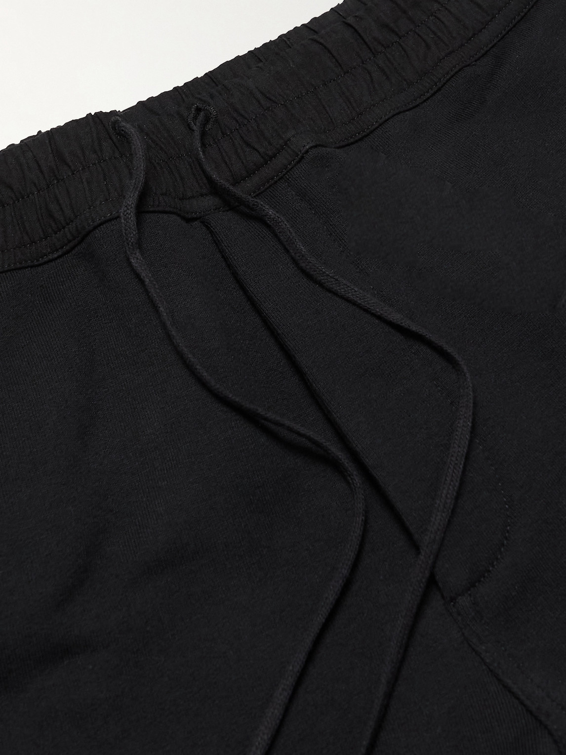 Shop Saint Laurent Tapered Logo-embroidered Cotton-jersey Sweatpants In Black