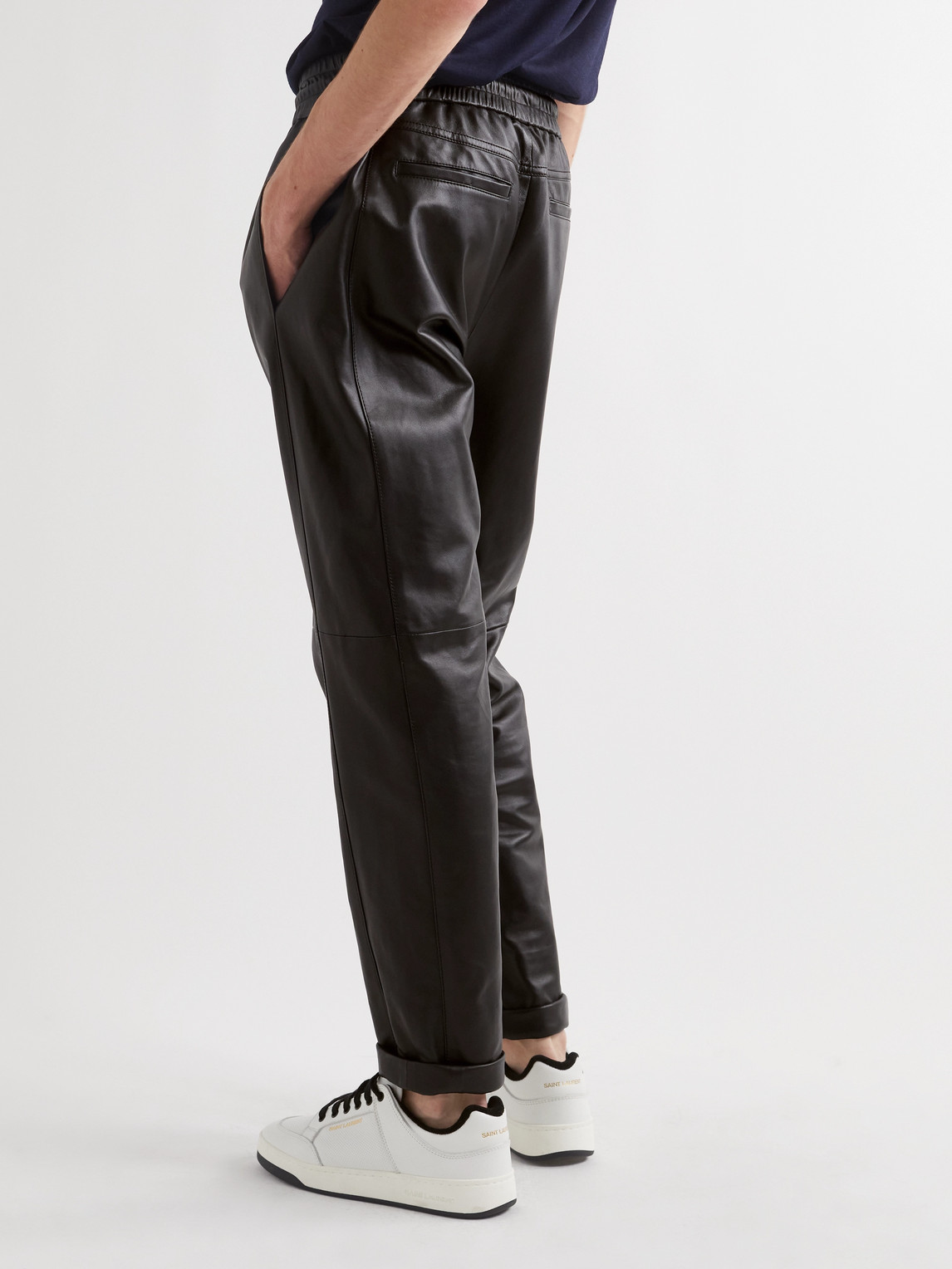 Shop Saint Laurent Tapered Leather Sweatpants In Black