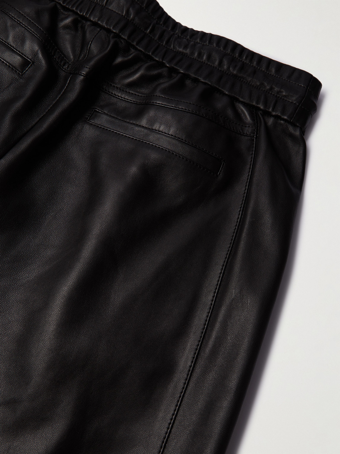 Shop Saint Laurent Tapered Leather Sweatpants In Black