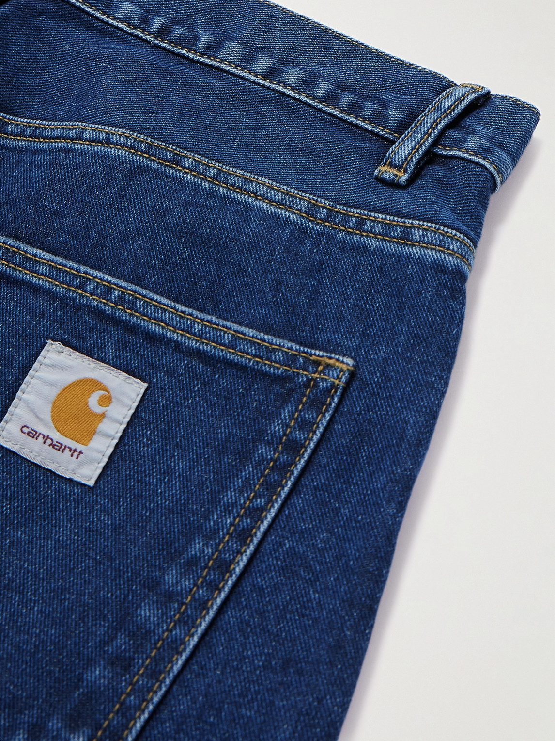 Shop Carhartt Newel Tapered Logo-appliquéd Jeans In Blue