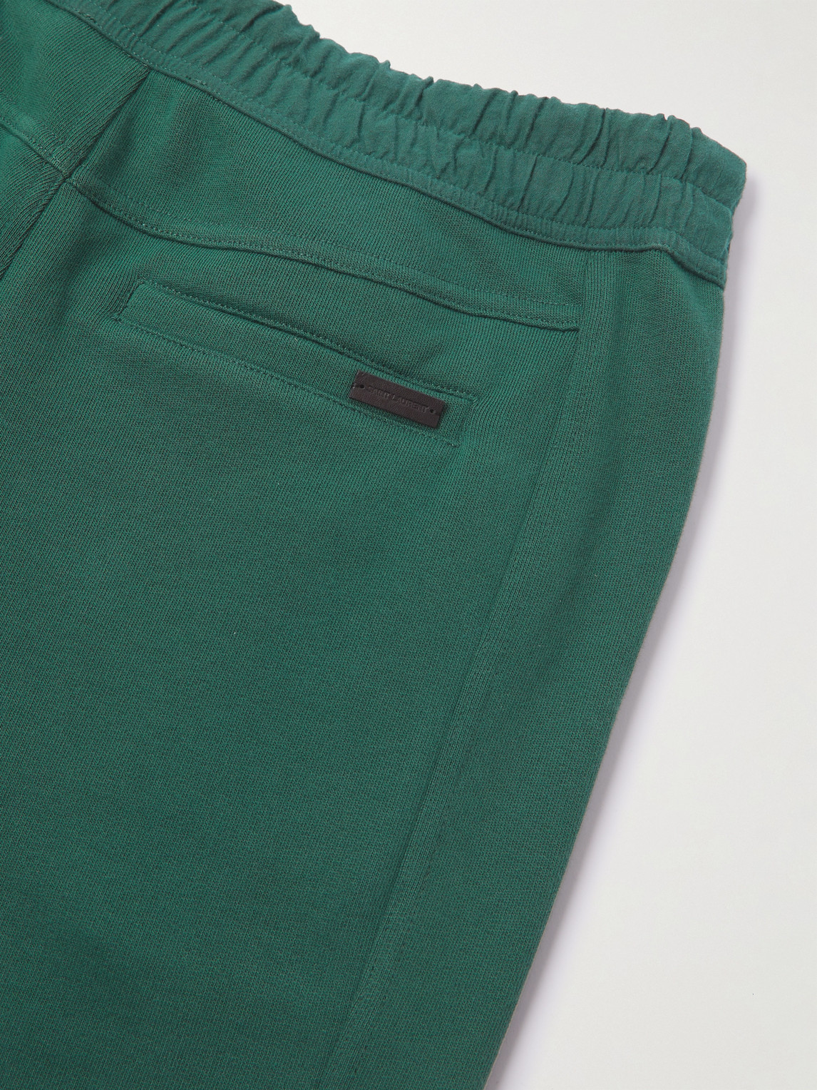 Shop Saint Laurent Tapered Logo-embroidered Cotton-jersey Sweatpants In Green