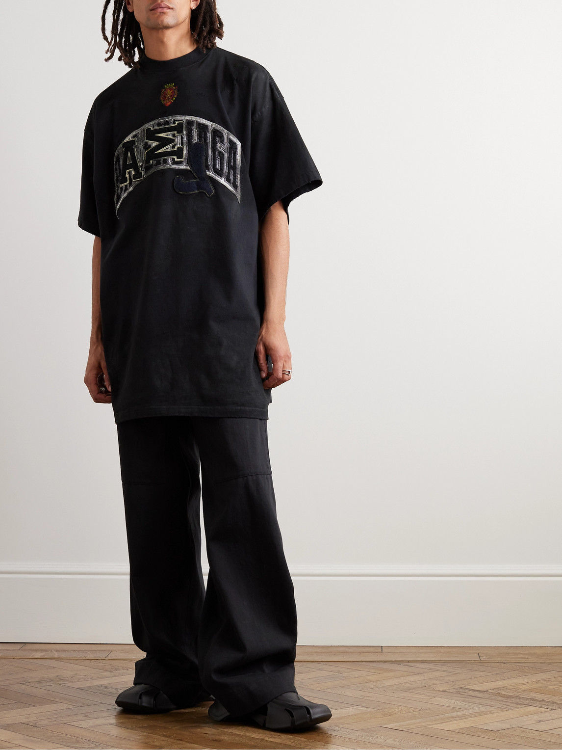 Shop Balenciaga Oversized Distressed Logo-appliquéd Cotton-jersey T-shirt In Black