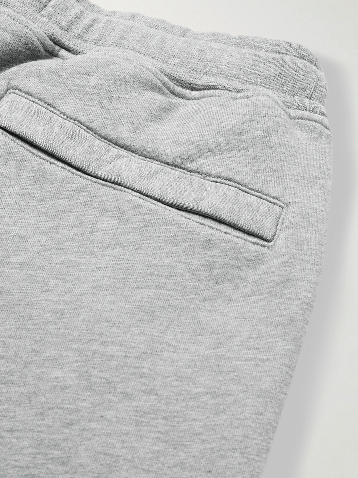Shop Stone Island Tapered Logo-appliquéd Cotton-jersey Sweatpants In Gray