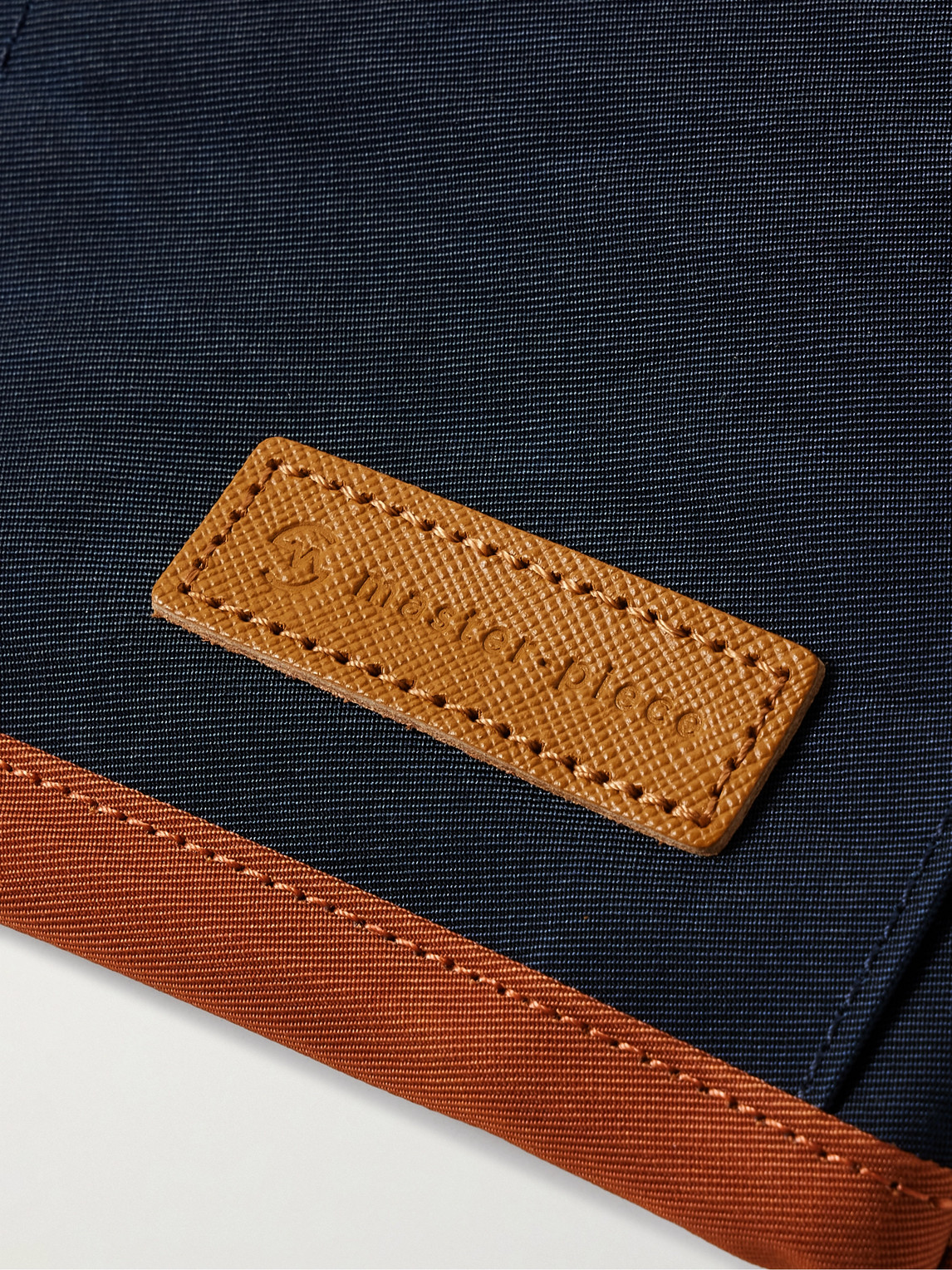 Shop Master-piece Link Leather-trimmed Colour-block Twill Messenger Bag In Blue