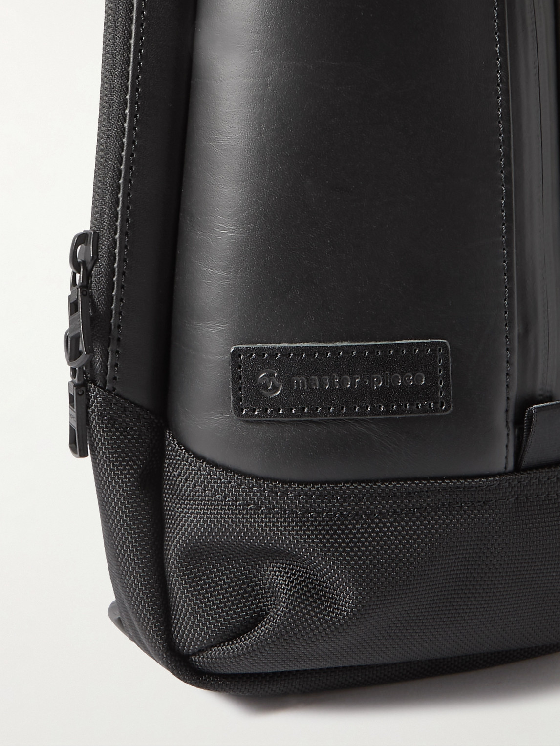 Shop Master-piece Slick Logo-appliquéd Leather And Cordura® Barastec Nylon Sling Backpack In Black