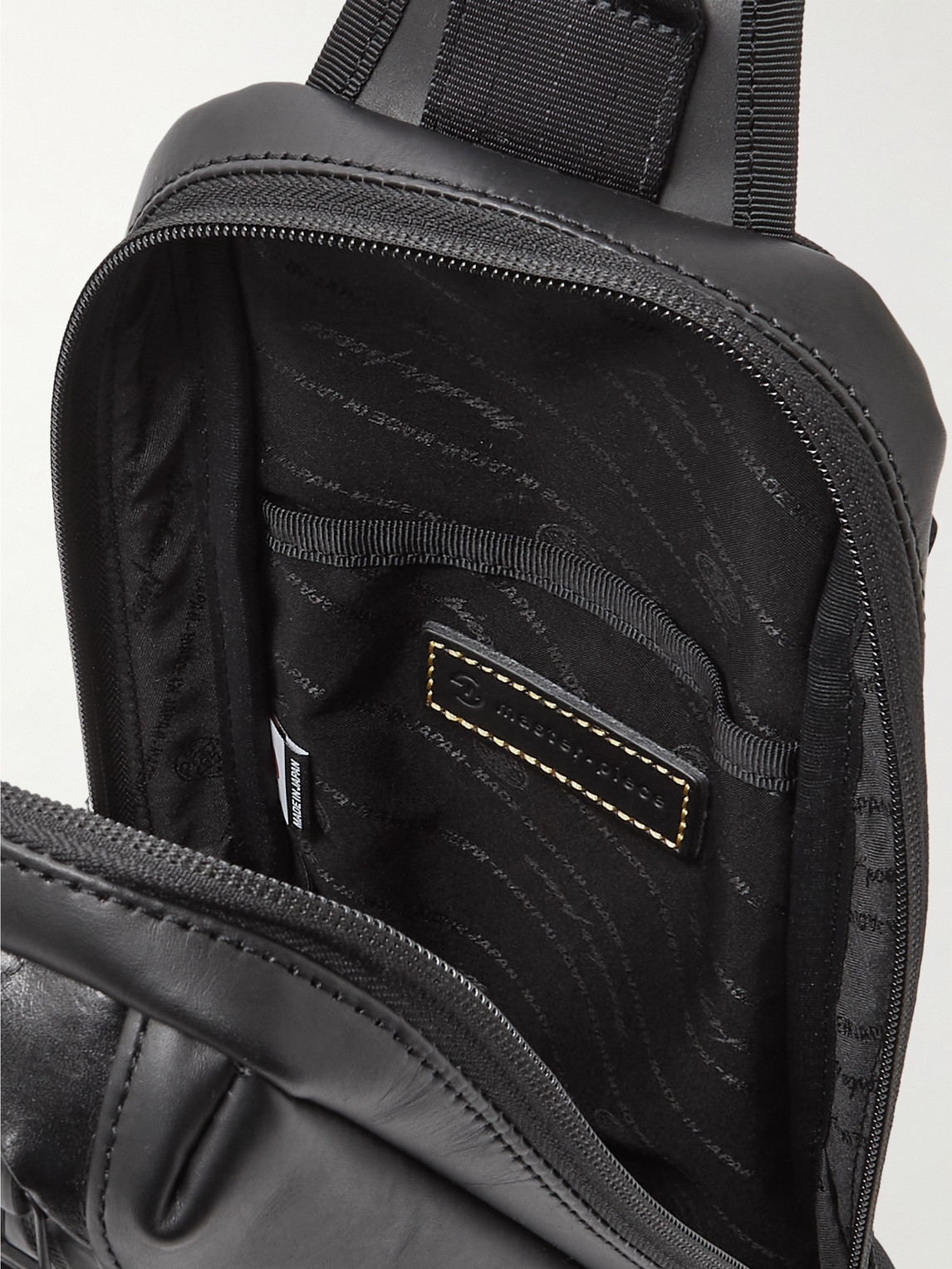 Shop Master-piece Slick Logo-appliquéd Leather And Cordura® Barastec Nylon Sling Backpack In Black