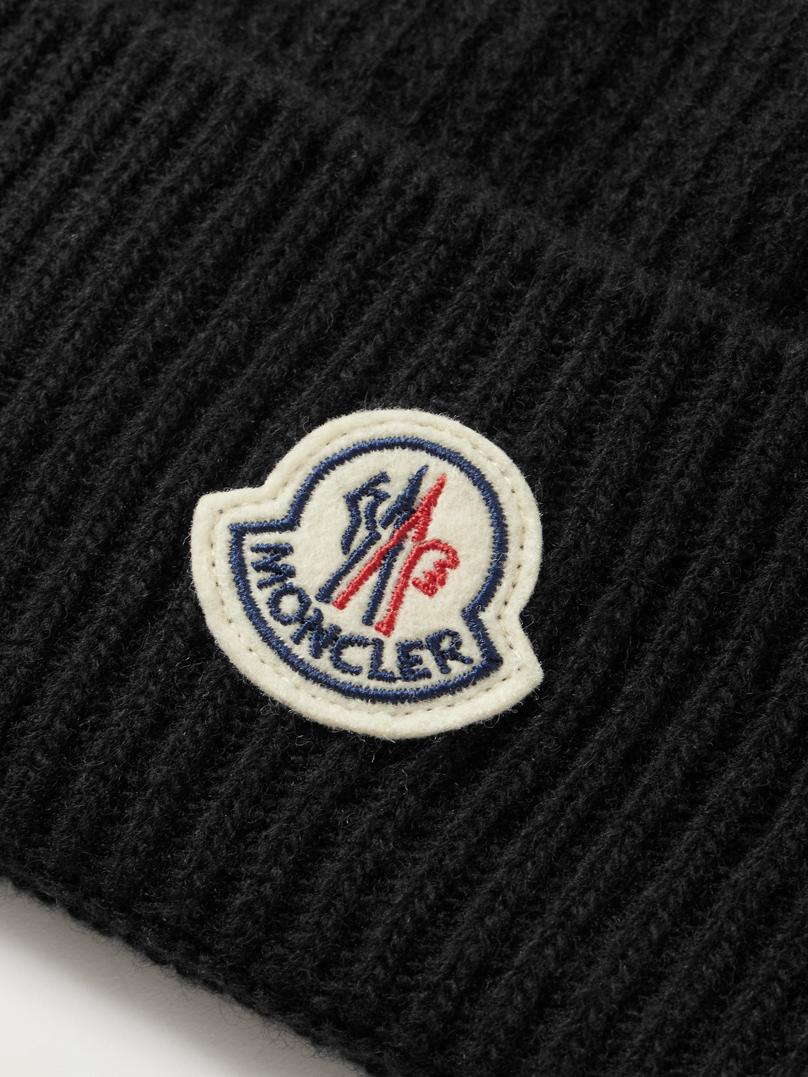 MONCLER LOGO-APPLIQUÉD RIBBED VIRGIN WOOL AND CASHMERE-BLEND BEANIE