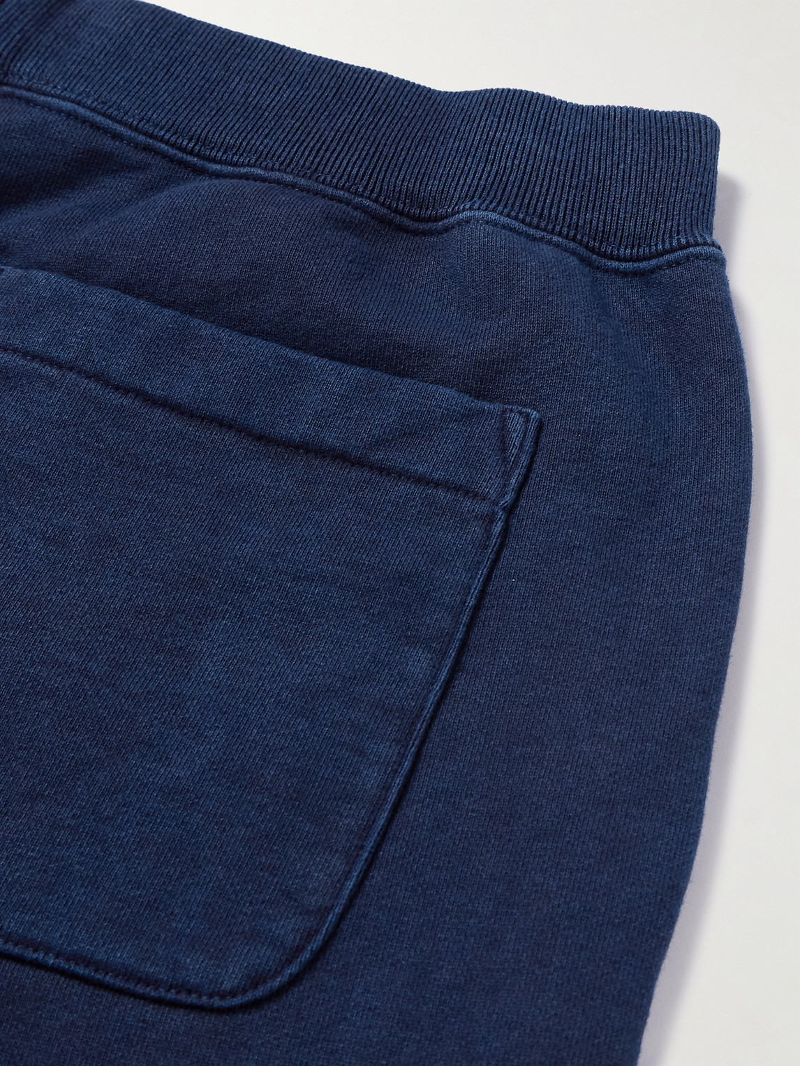 Blue Blue Japan Tapered Indigo-dyed Cotton-jersey Sweatpants In Blue