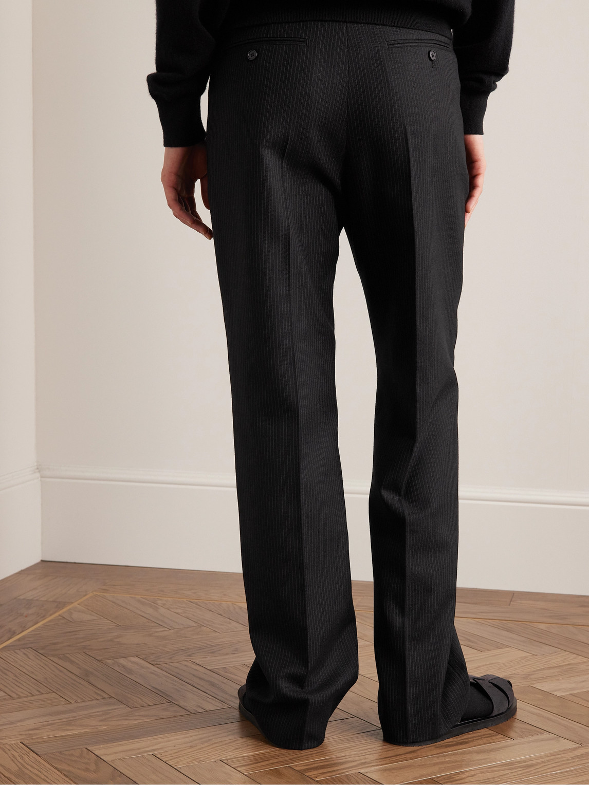 Shop The Row Baird Straight-leg Pleated Pinstriped Virgin Wool Trousers In Black