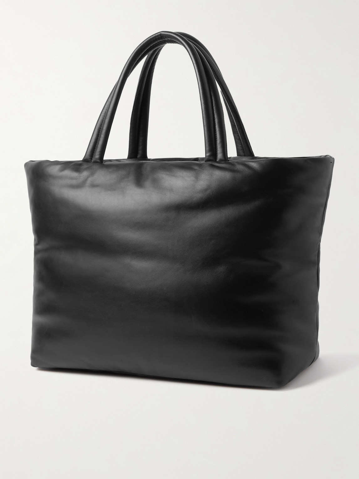 Shop Saint Laurent Logo-debossed Padded Leather Tote Bag In Black