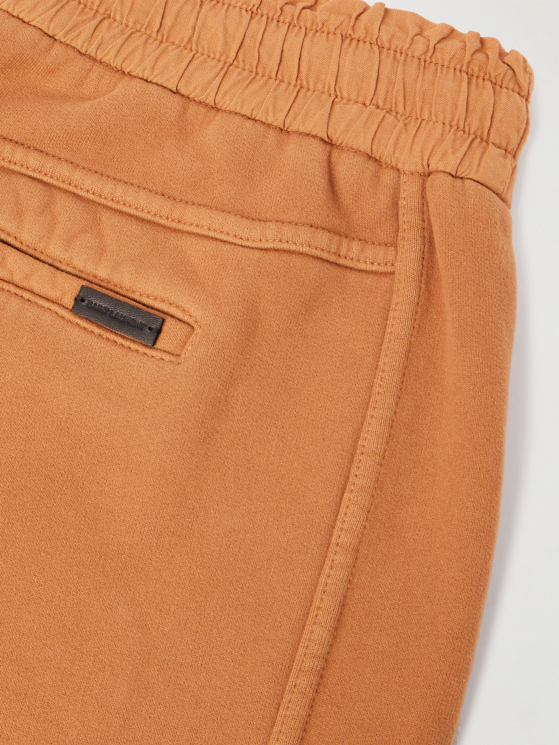 Shop Saint Laurent Tapered Cotton-jersey Sweatpants In Orange