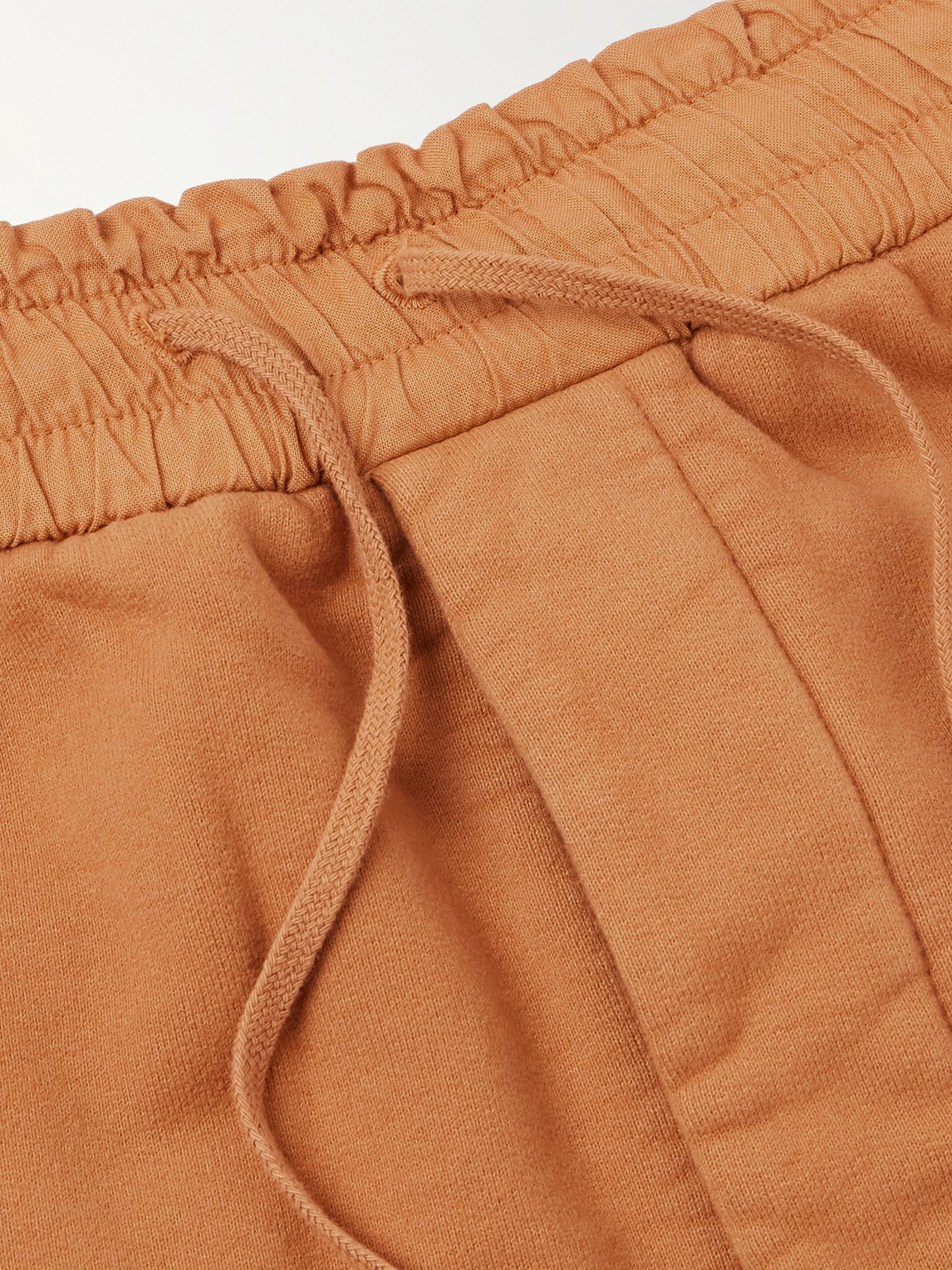 Shop Saint Laurent Tapered Cotton-jersey Sweatpants In Orange