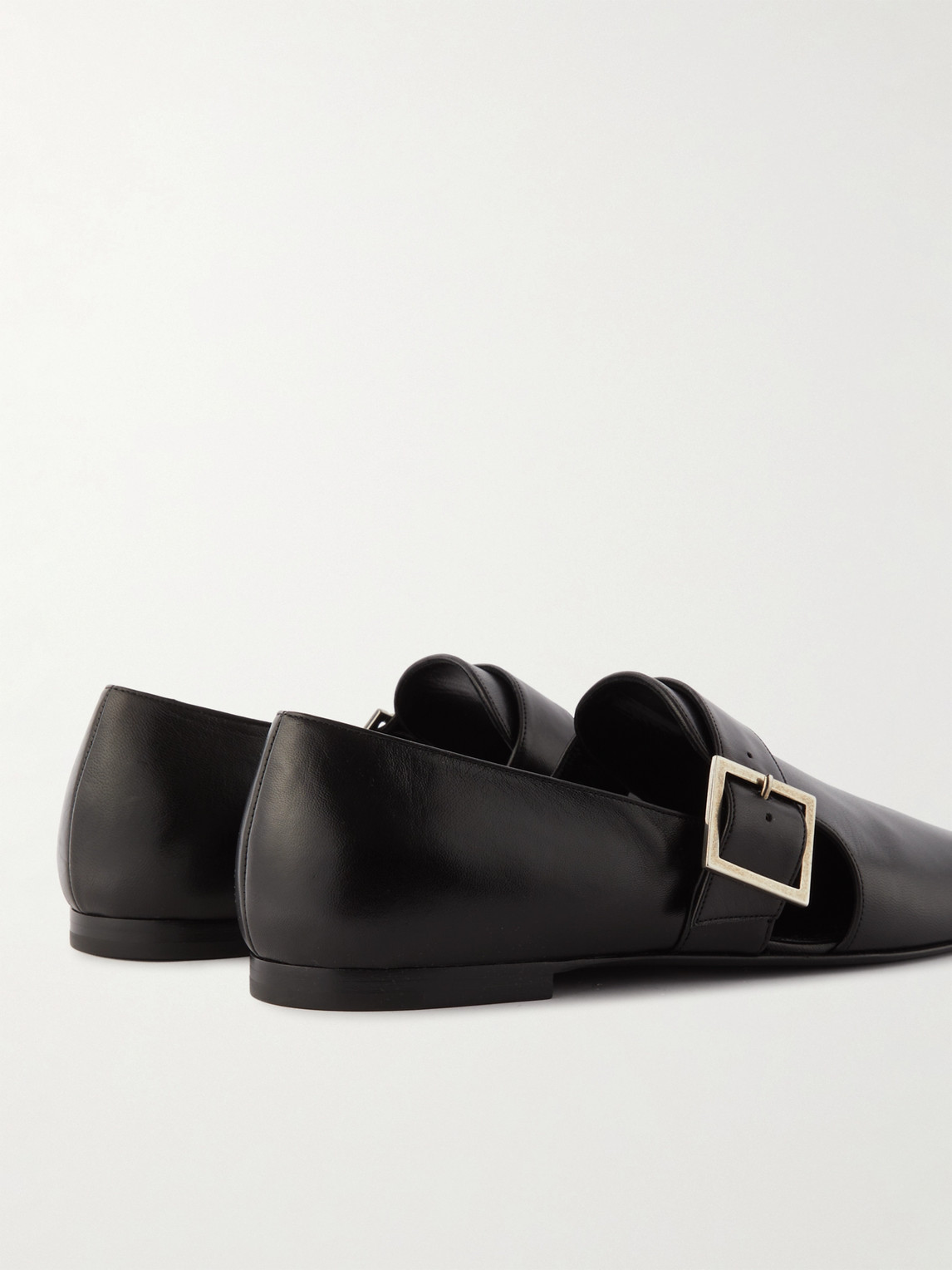 Shop Saint Laurent Tristan Buckled Leather Loafers In Black