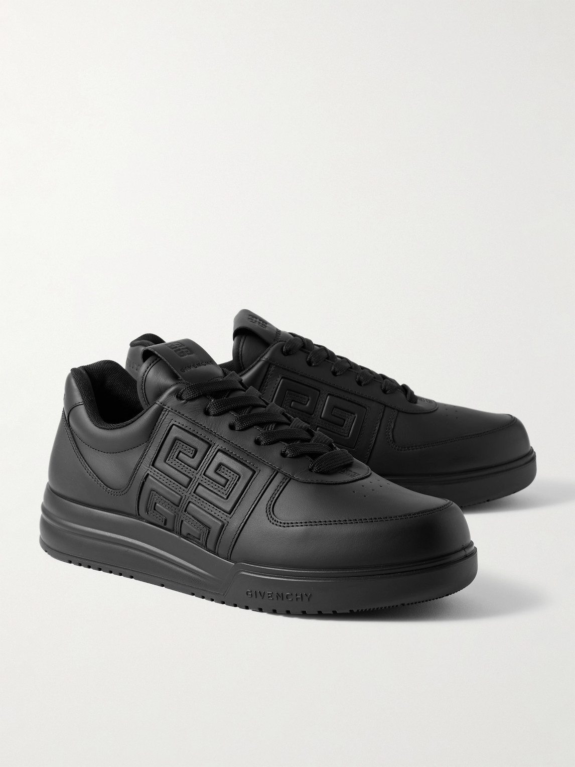 Shop Givenchy G4 Logo-embossed Leather Sneakers In Black