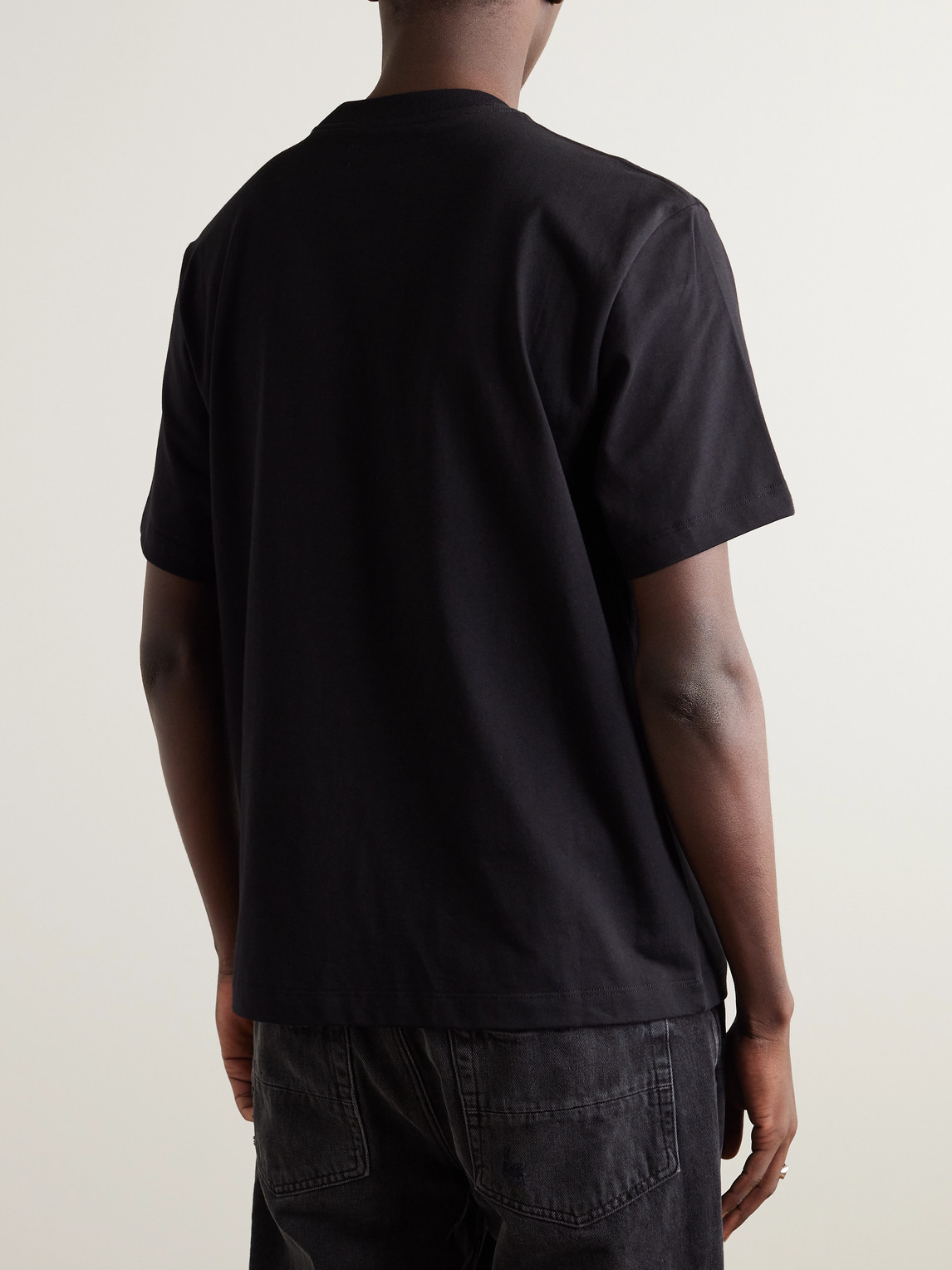 Shop Amiri Staggered Logo-print Cotton-jersey T-shirt In Black