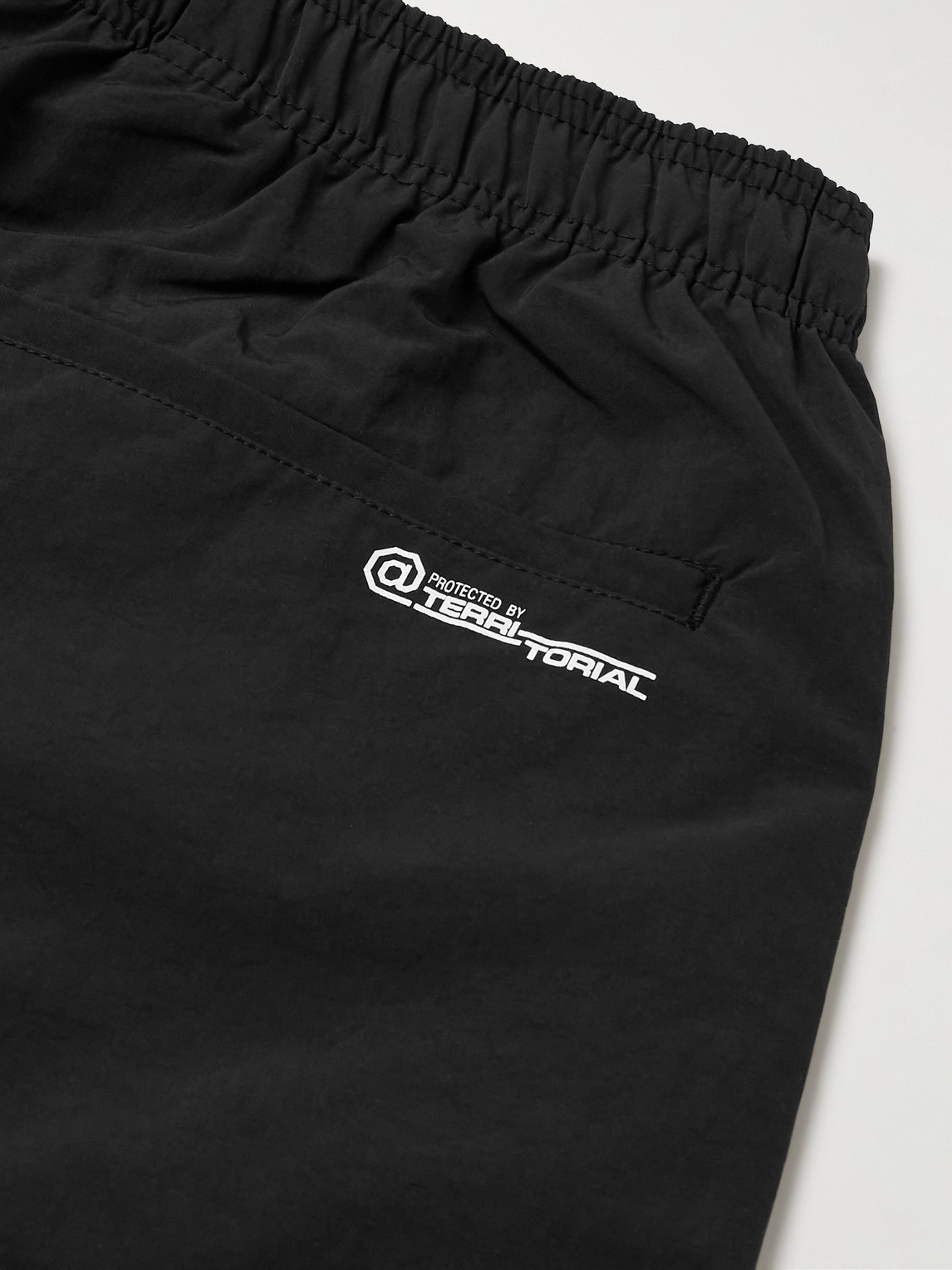 Shop Wtaps Logo-print Tapered Nylon Drawstring Trousers In Black