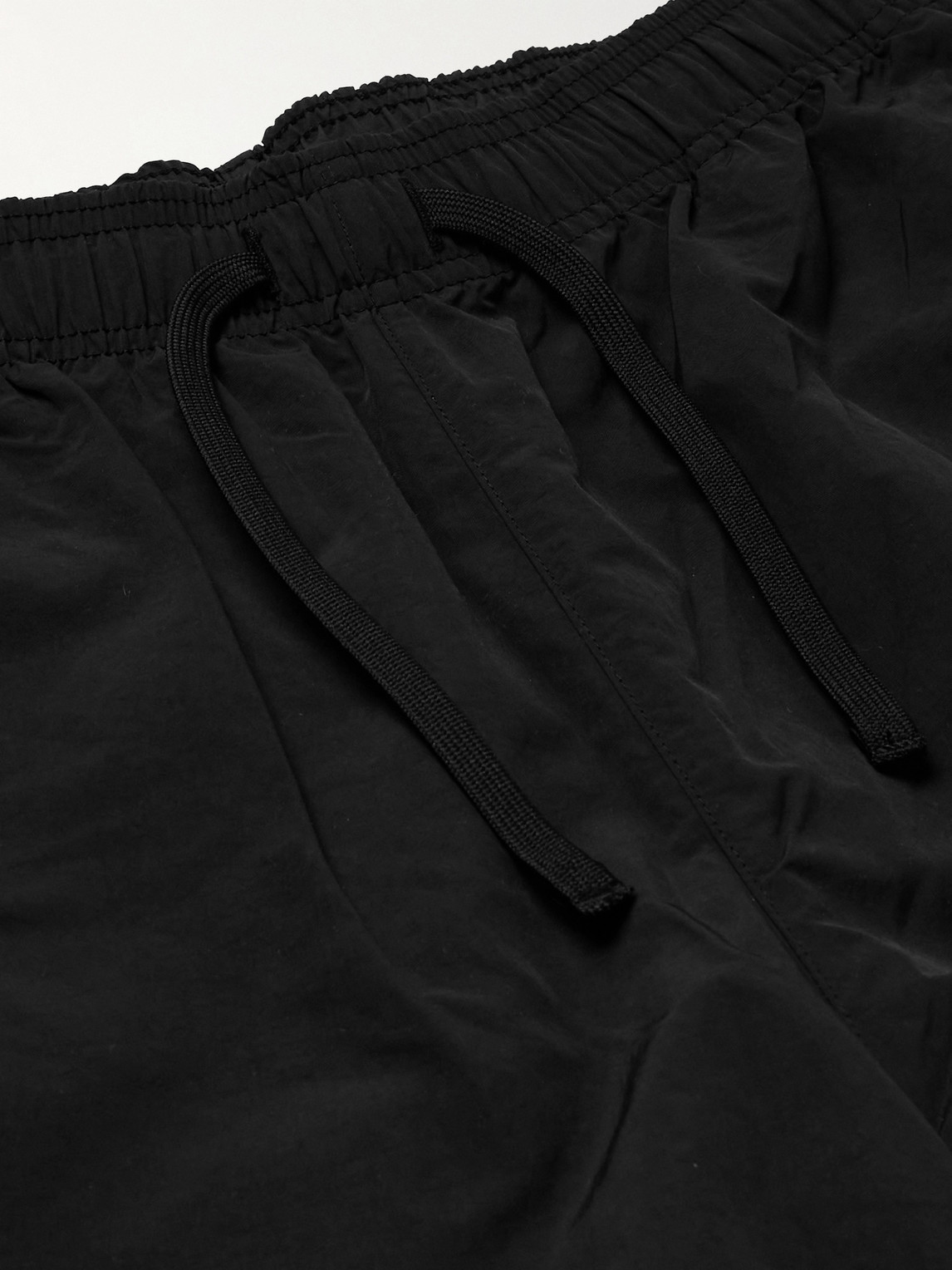 Shop Wtaps Logo-print Tapered Nylon Drawstring Trousers In Black
