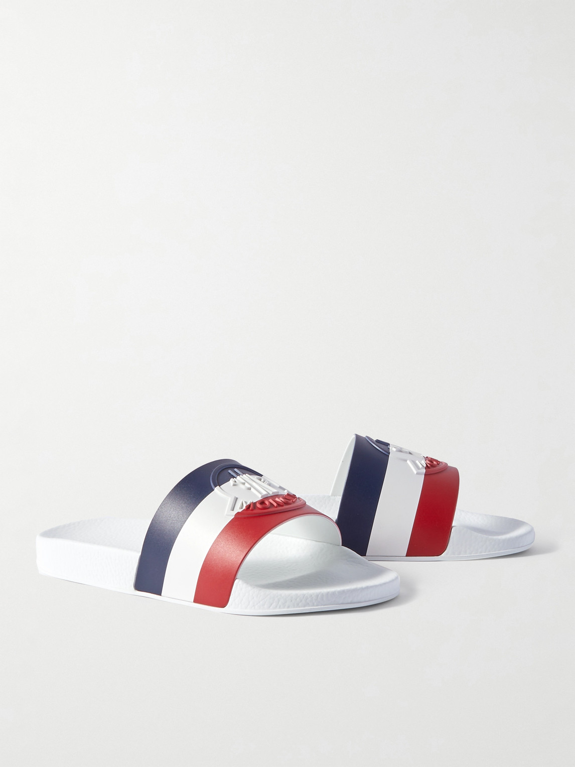 Shop Moncler Basile Logo-embossed Striped Rubber Slides In White