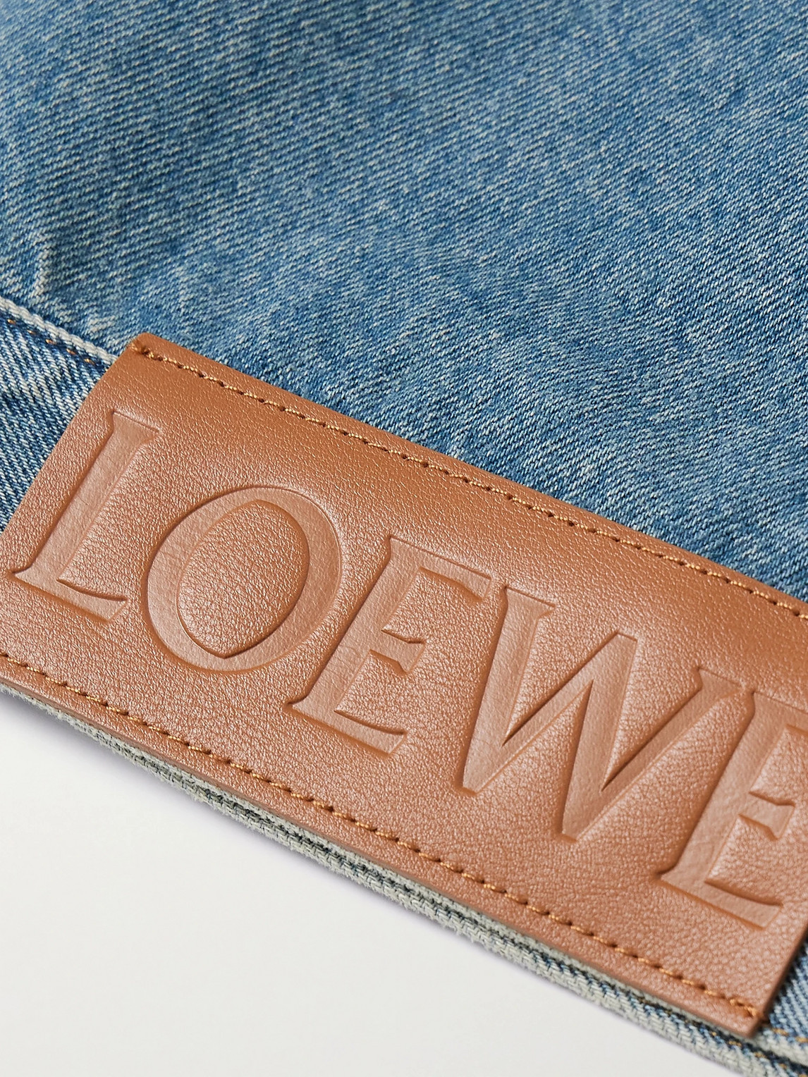 Shop Loewe Anagram Leather-trimmed Cutout Denim Trucker Jacket In Blue