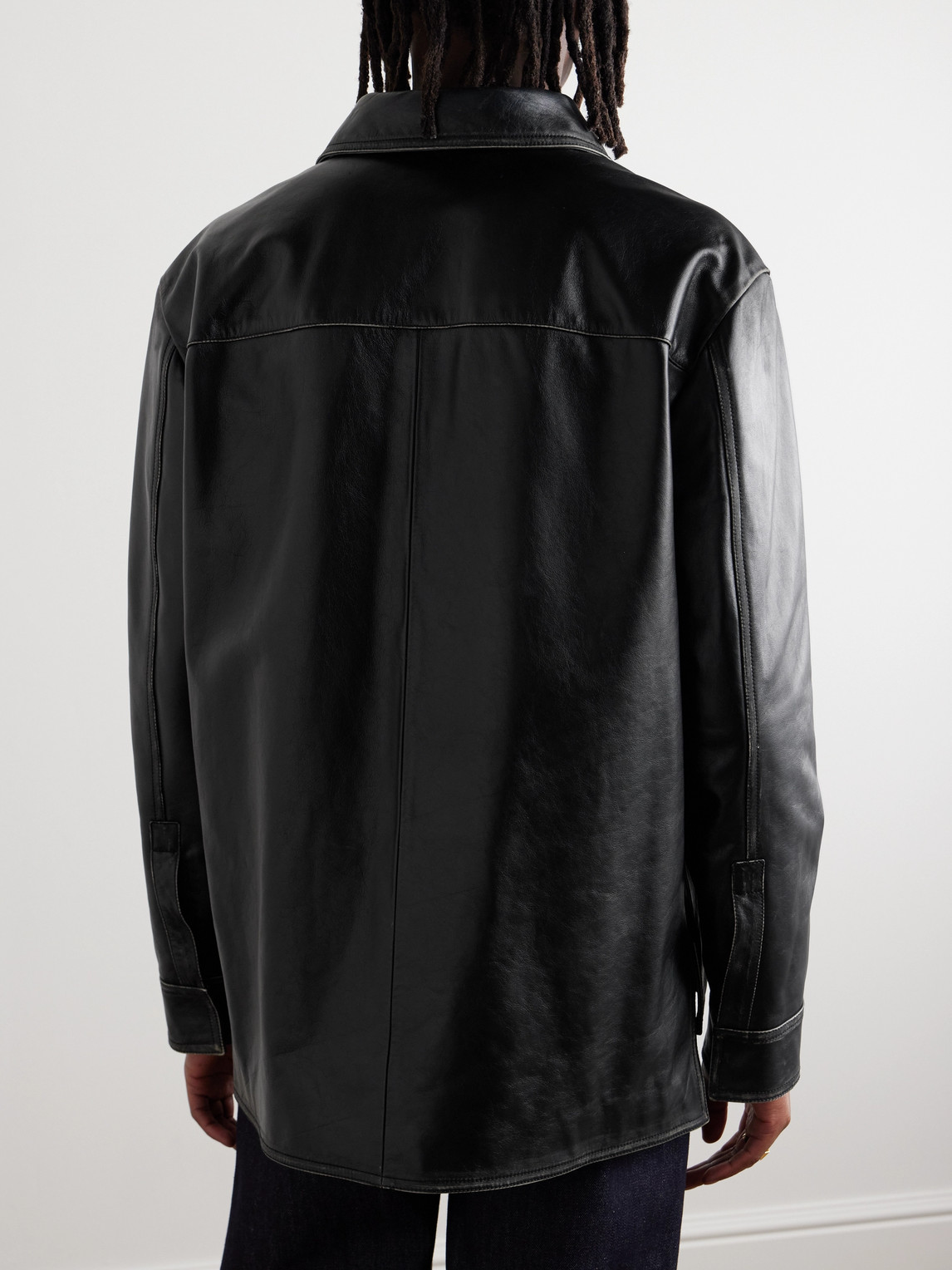 Shop Loewe Logo-embossed Distressed Leather Jacket In Black