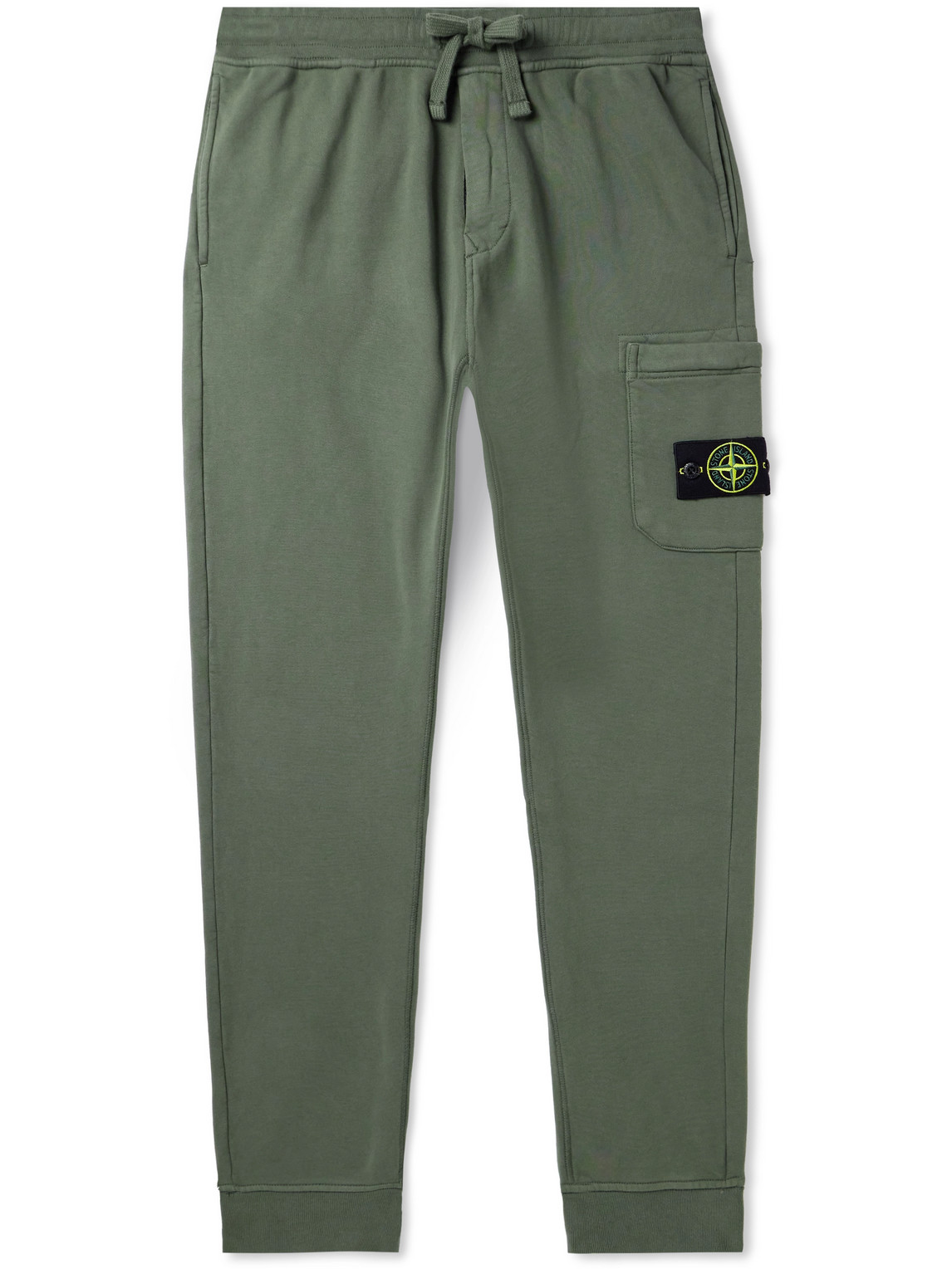 Shop Stone Island Tapered Logo-appliquéd Garment-dyed Cotton-jersey Sweatpants In Green