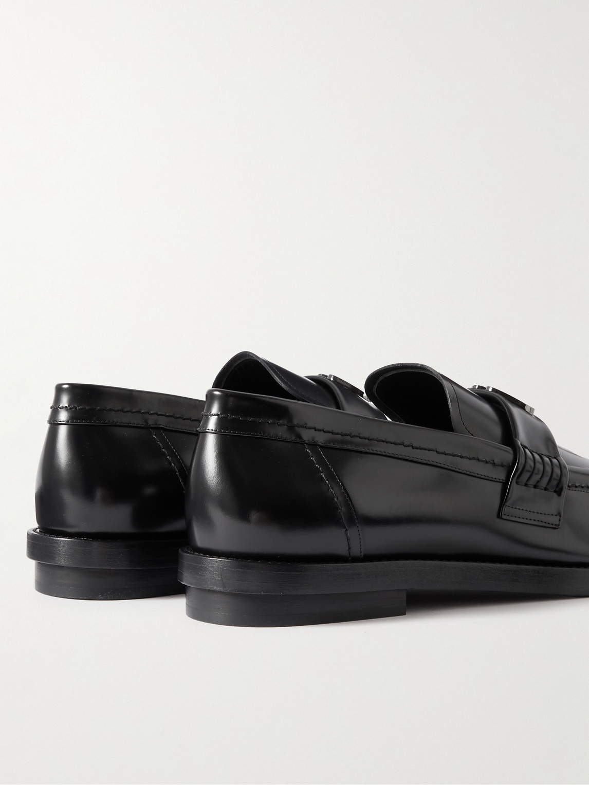 Shop Alexander Mcqueen Seal Embellished Leather Penny Loafers In Black