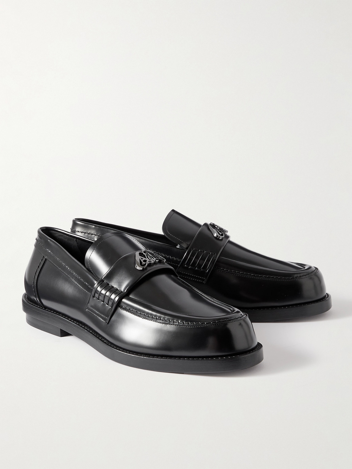 Shop Alexander Mcqueen Seal Embellished Leather Penny Loafers In Black