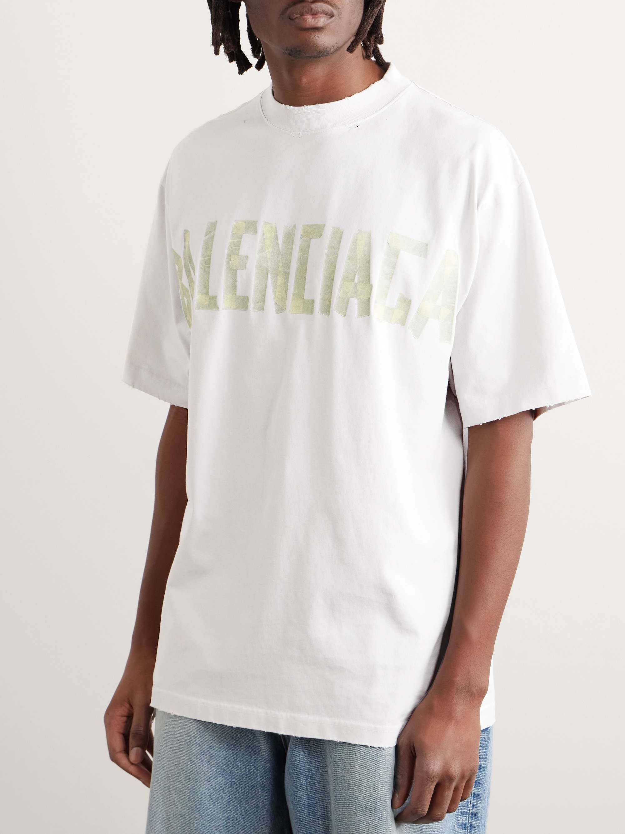 BALENCIAGA T-shirt oversize in jersey di cotone effetto consumato con logo