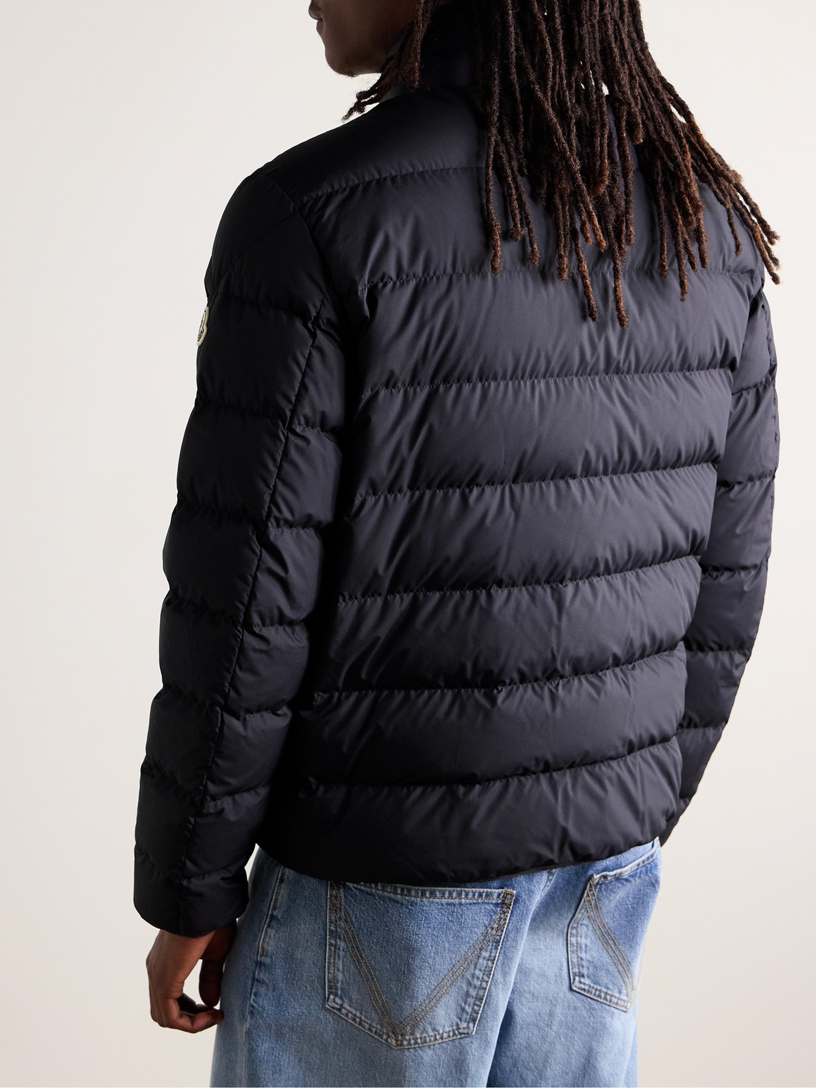 Moncler Quilted Down Jacket With High Collar And Logo Patch In Blue