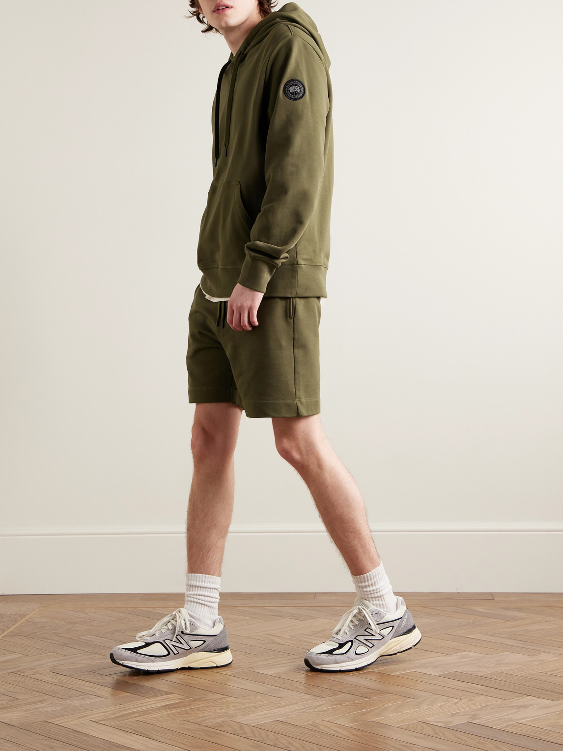 Shop Canada Goose Huron Logo-appliquéd Cotton-jersey Hoodie In Green