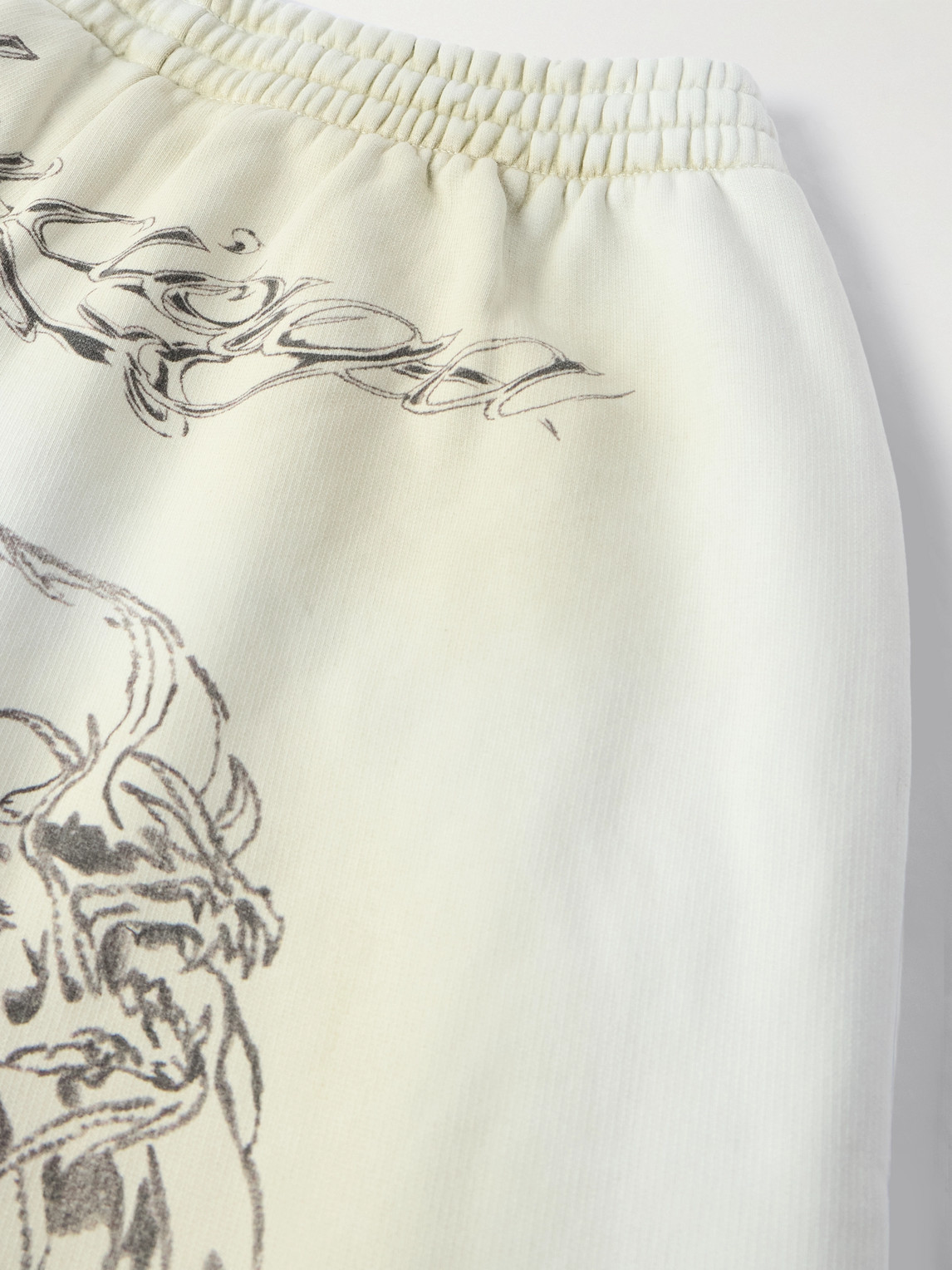 Shop Balenciaga Wide-leg Printed Distressed Cotton-jersey Sweatpants In White